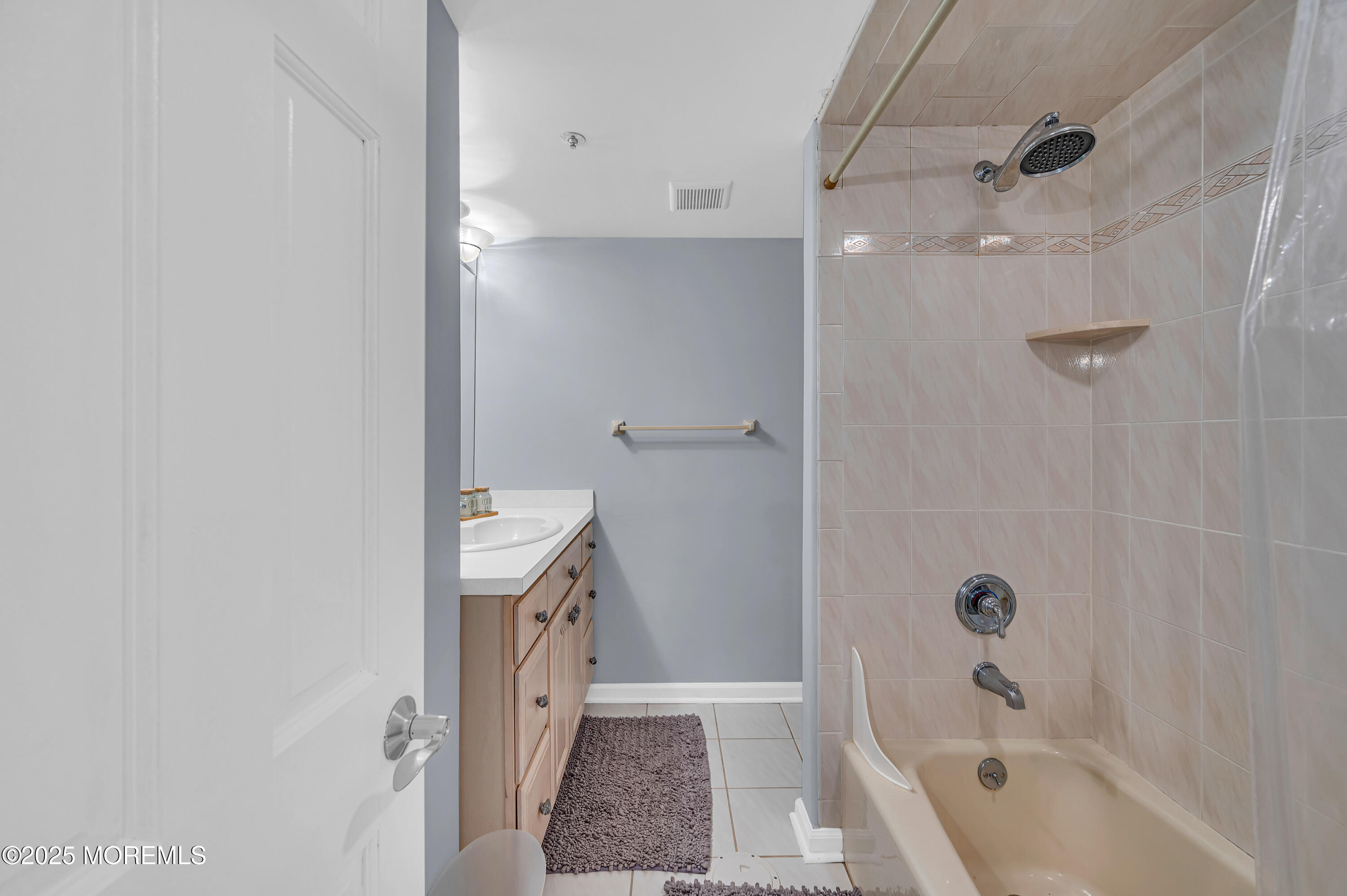 15 East Tuna Way, Unit B Lavallette, NJ 08735 - Photo 24 of 33 a bathroom with a tub a sink and a shower
