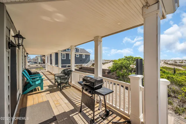 a view of a balcony with chairs