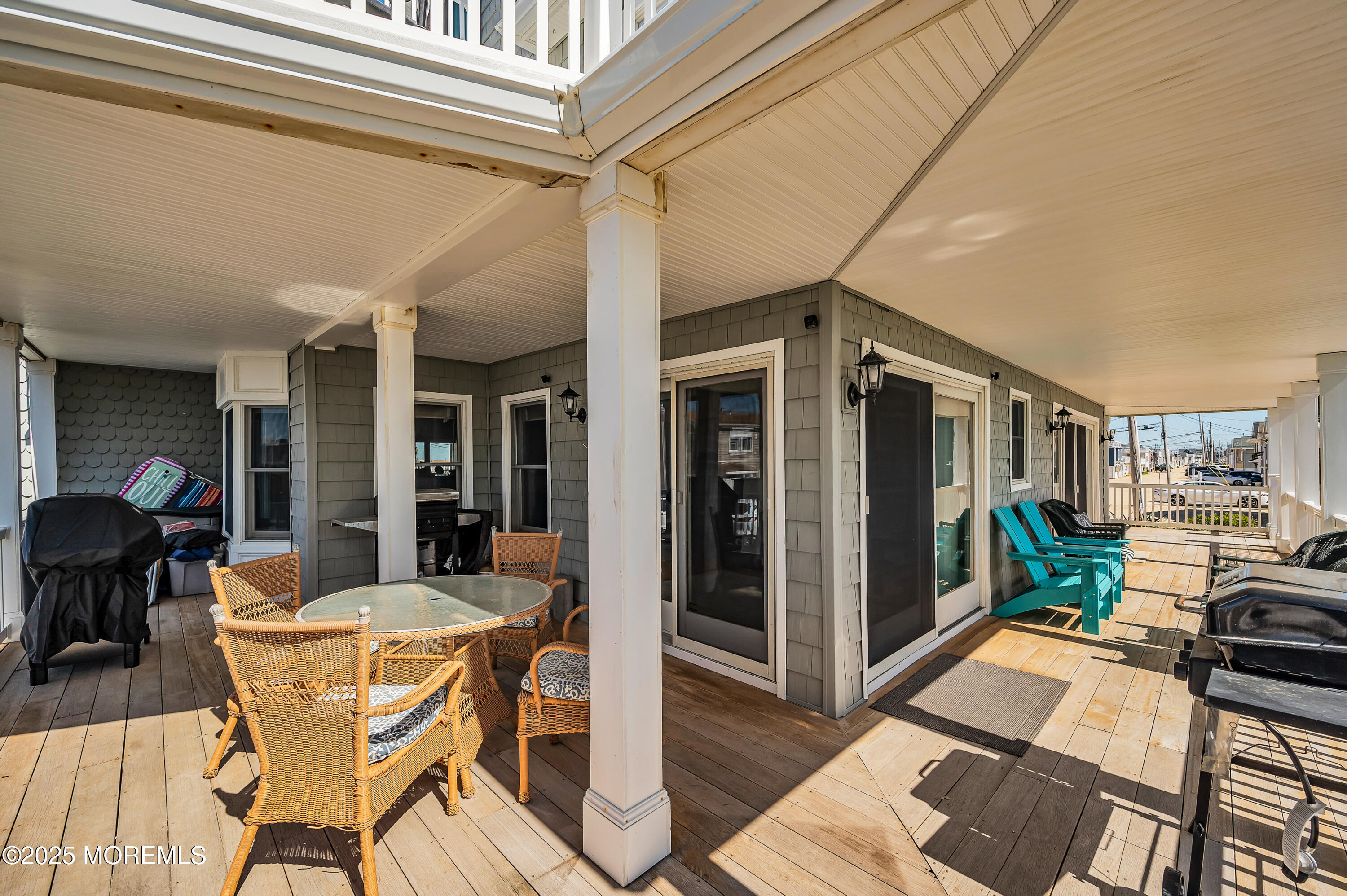 15 East Tuna Way, Unit B Lavallette, NJ 08735 - Photo 29 of 33 a view of a dining room with furniture a chandelier and wooden floor