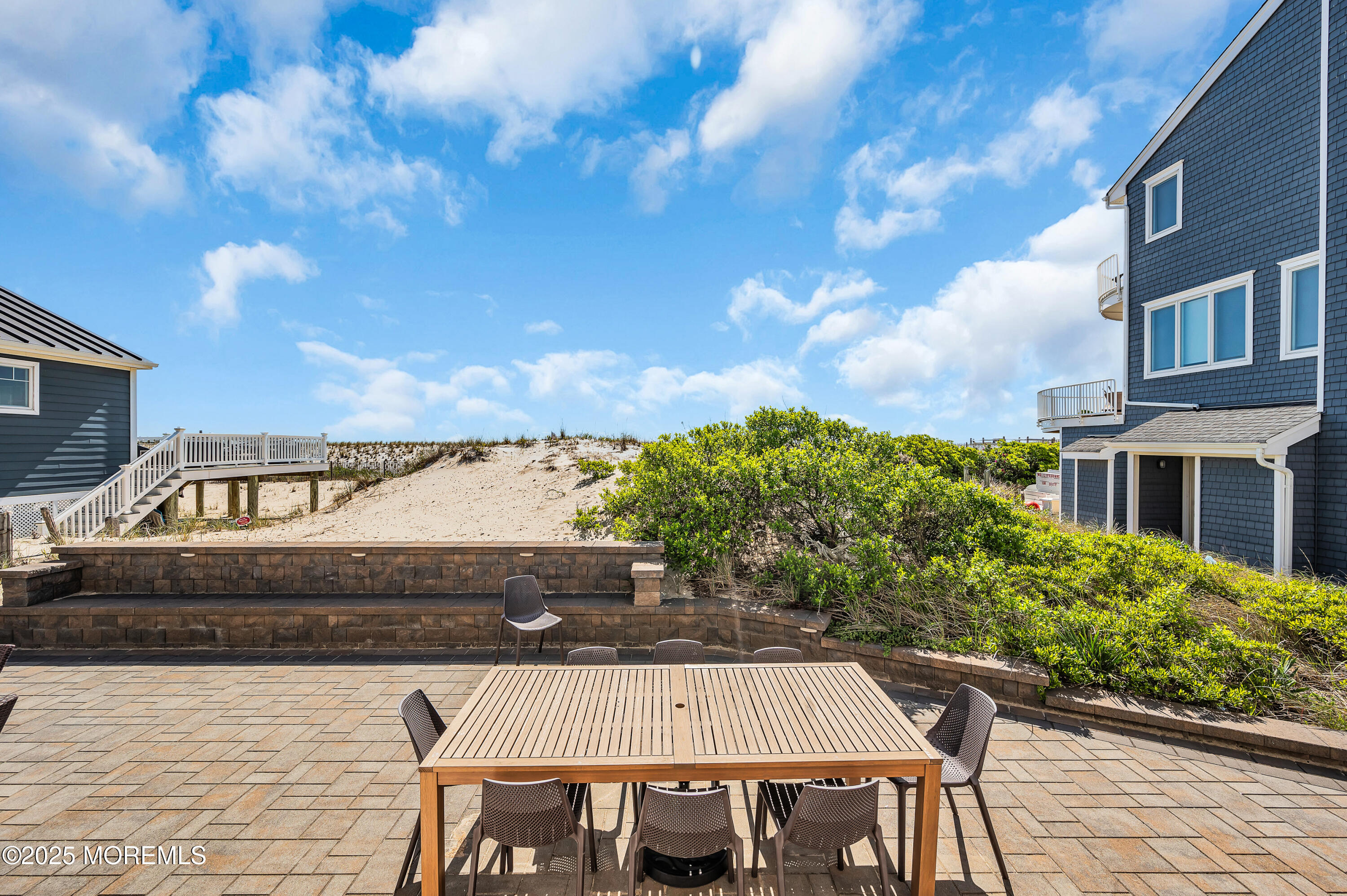 15 East Tuna Way, Unit B Lavallette, NJ 08735 - Photo 31 of 33 a view of a patio with table and chairs and potted plants