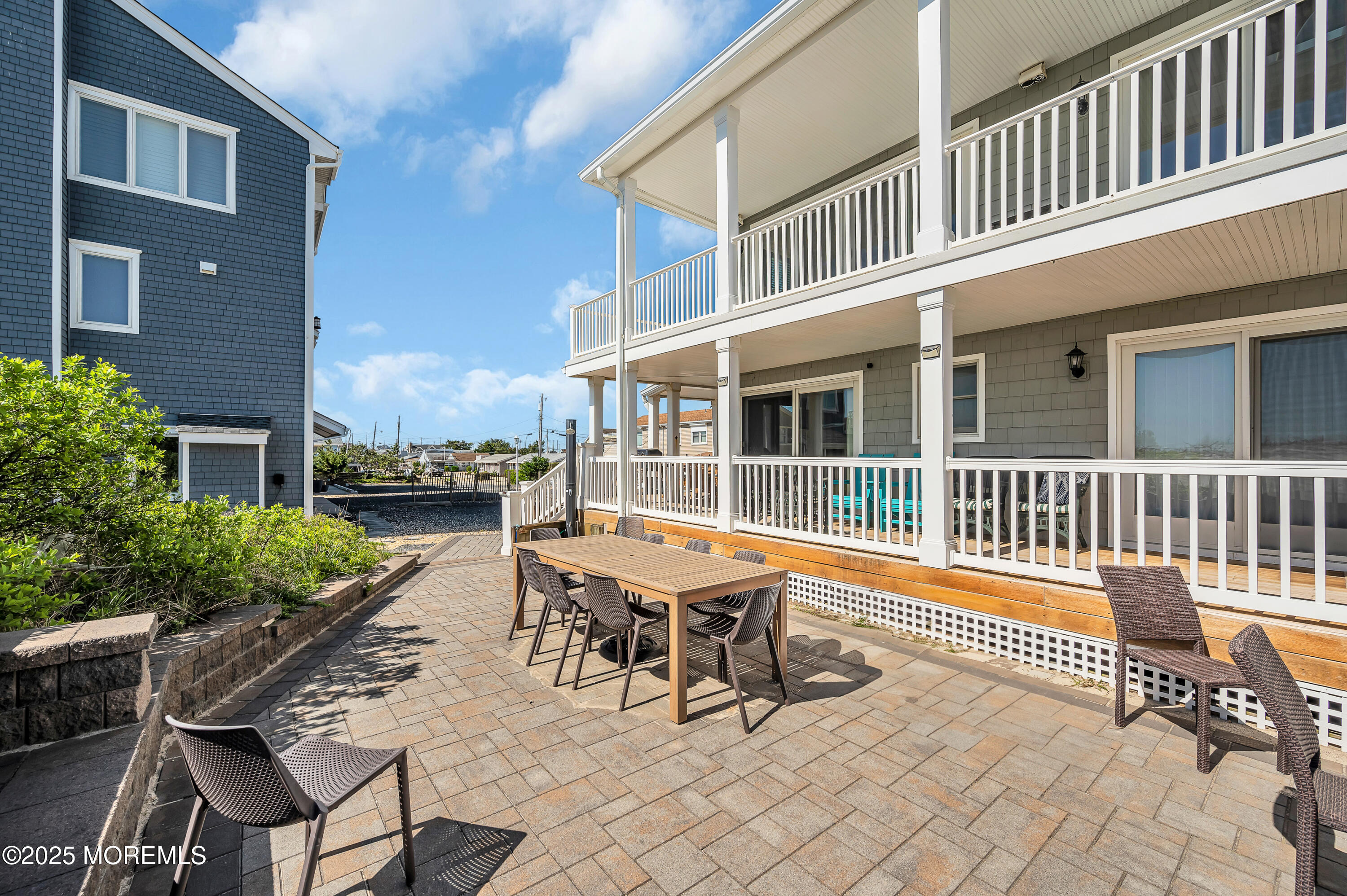 15 East Tuna Way, Unit B Lavallette, NJ 08735 - Photo 32 of 33 a backyard of a house with barbeque oven table and chairs