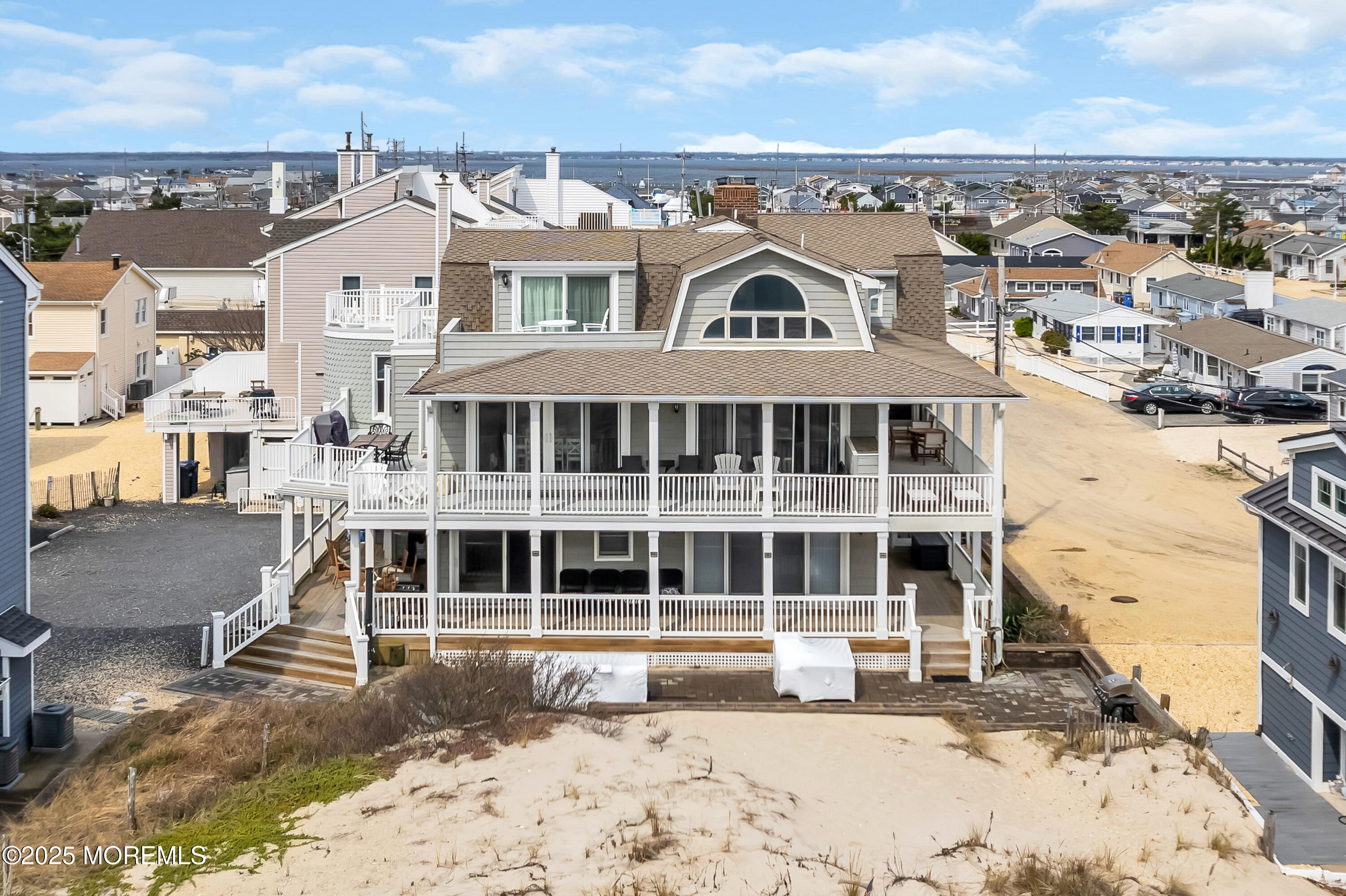 15 East Tuna Way, Unit B Lavallette, NJ 08735 - Photo 4 of 33 a view of a large building with a outdoor space