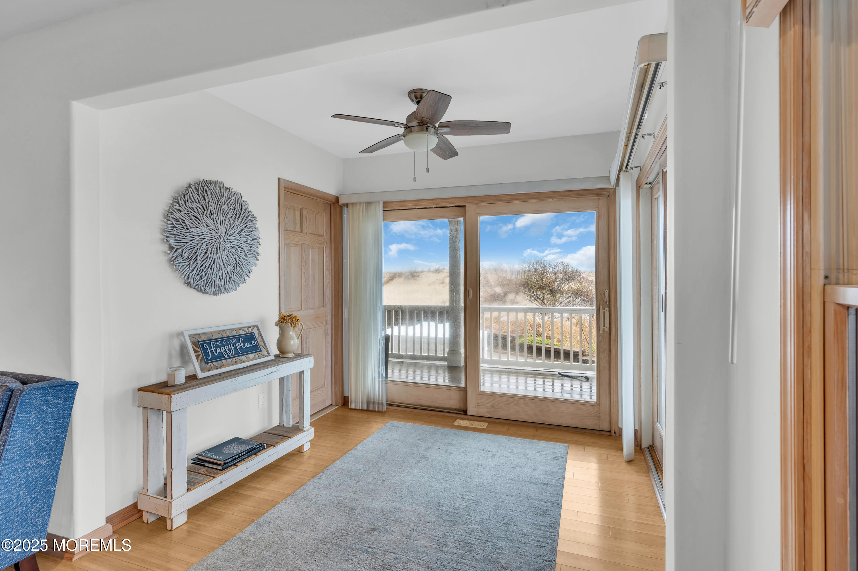 15 East Tuna Way, Unit B Lavallette, NJ 08735 - Photo 6 of 33 a view of a livingroom with a ceiling fan & windows