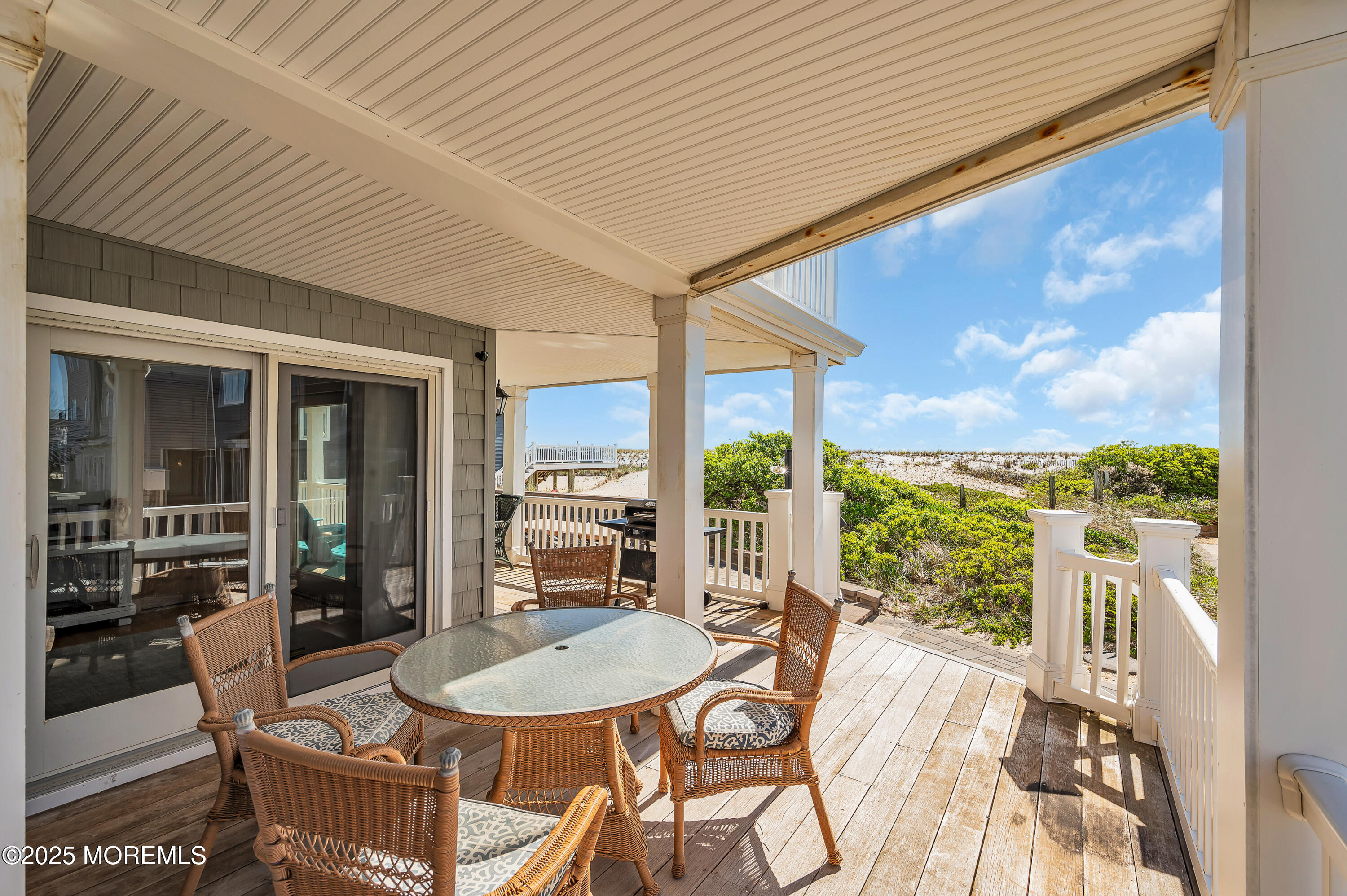 15 East Tuna Way, Unit B Lavallette, NJ 08735 - Photo 7 of 33 a dining room with furniture and a floor to ceiling window