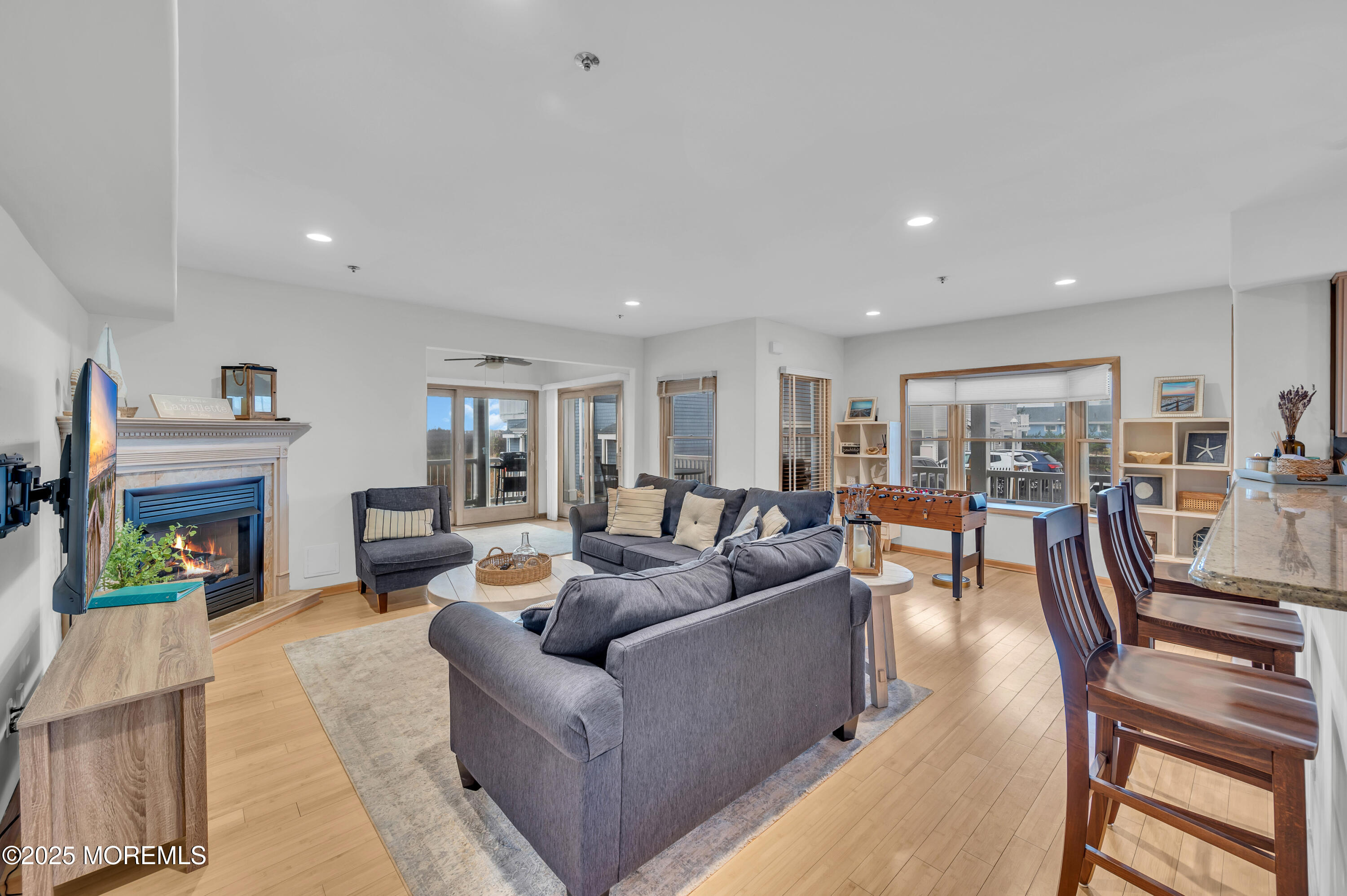 15 East Tuna Way, Unit B Lavallette, NJ 08735 - Photo 8 of 33 a living room with furniture and a fireplace