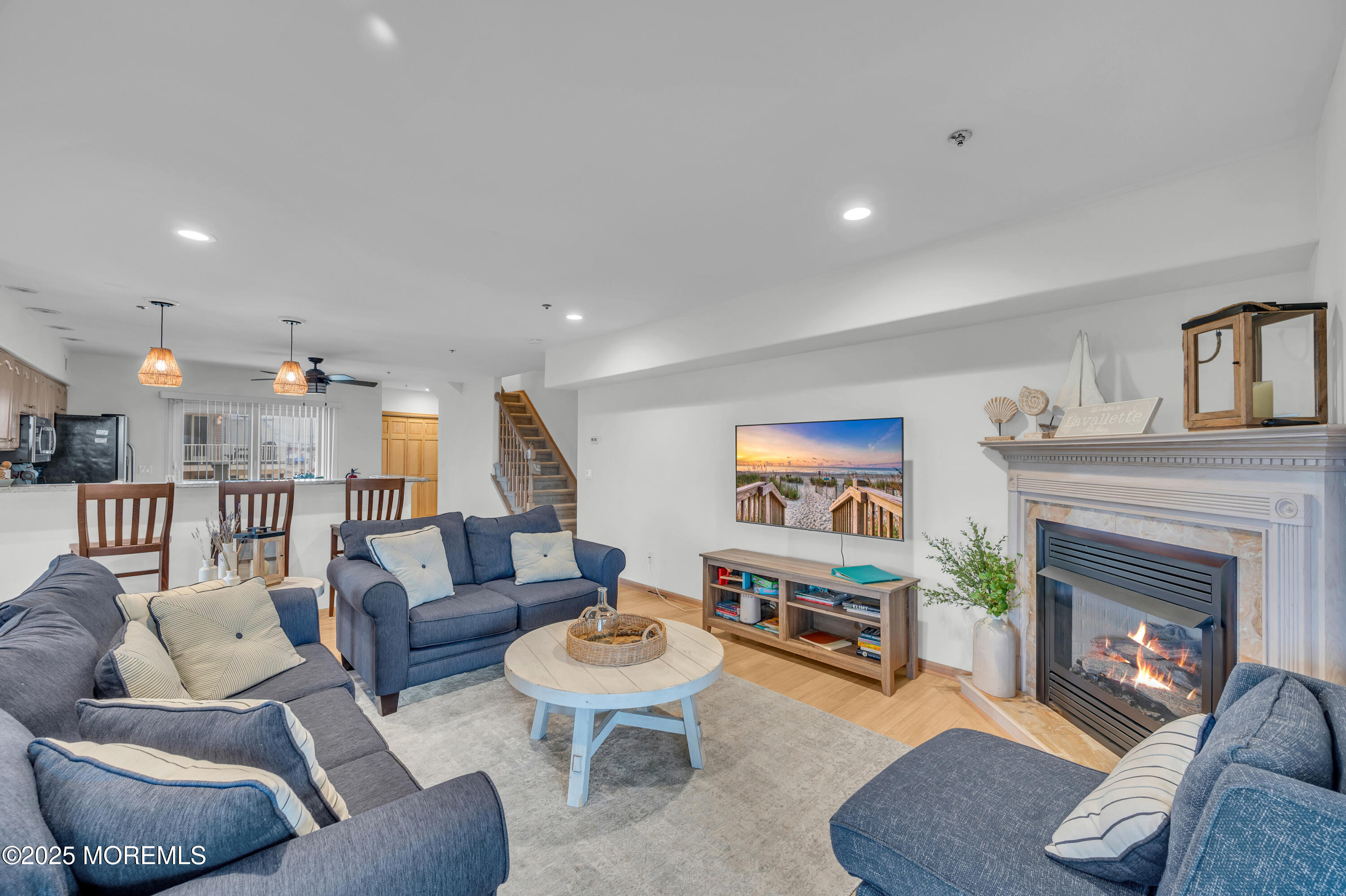 15 East Tuna Way, Unit B Lavallette, NJ 08735 - Photo 9 of 33 a living room with furniture and a fireplace