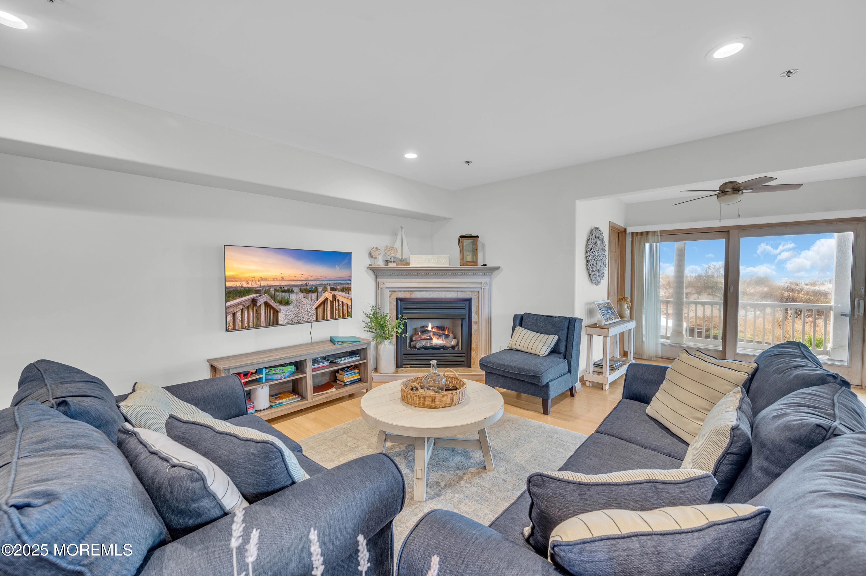 15 East Tuna Way, Unit B Lavallette, NJ 08735 - Photo 10 of 33 a living room with furniture large window and a fireplace
