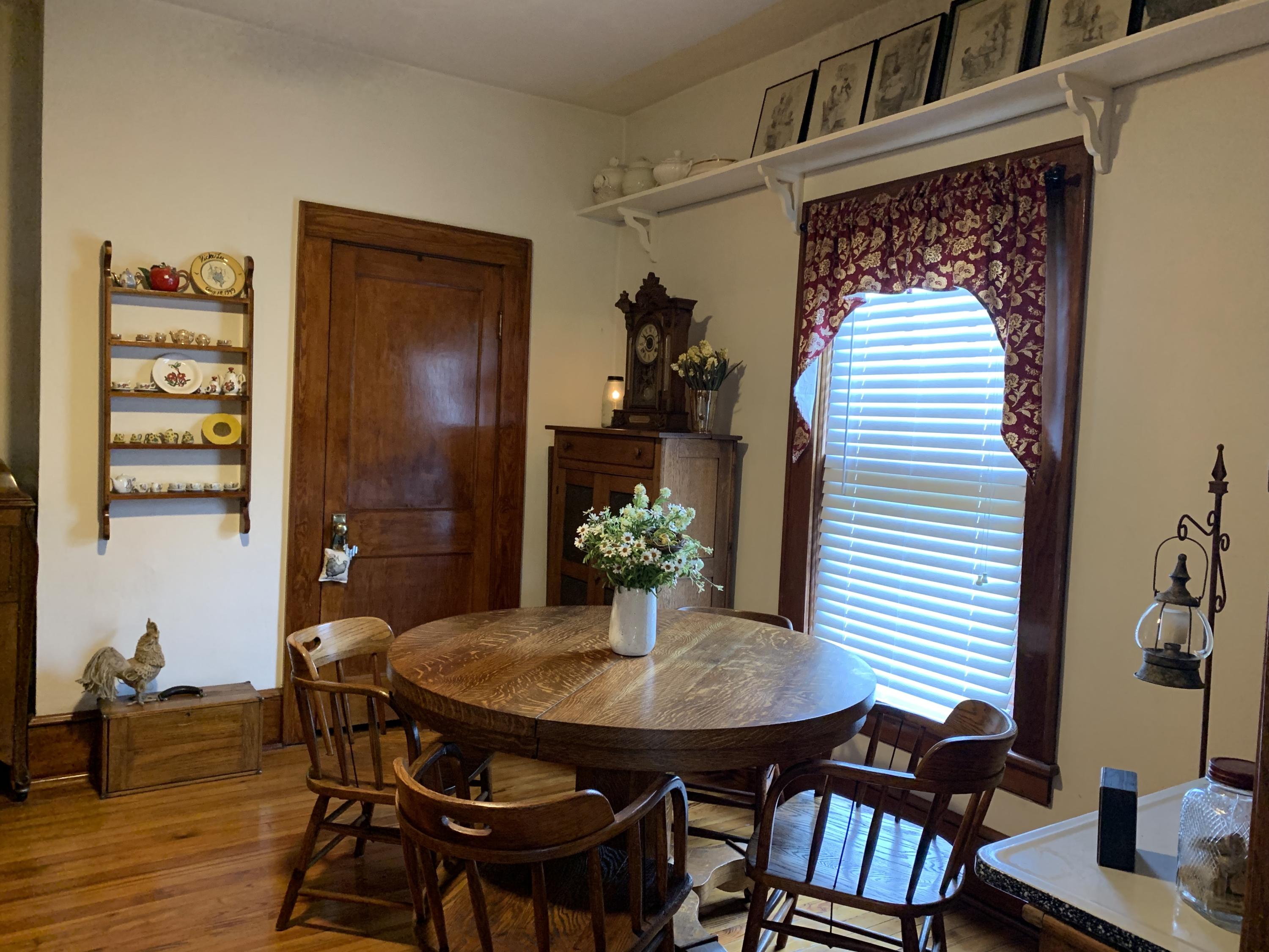 1763 Morgans Mill Road Goodview, VA 24095 - Photo 12 of 46 a view of a dining room with furniture and wooden floor