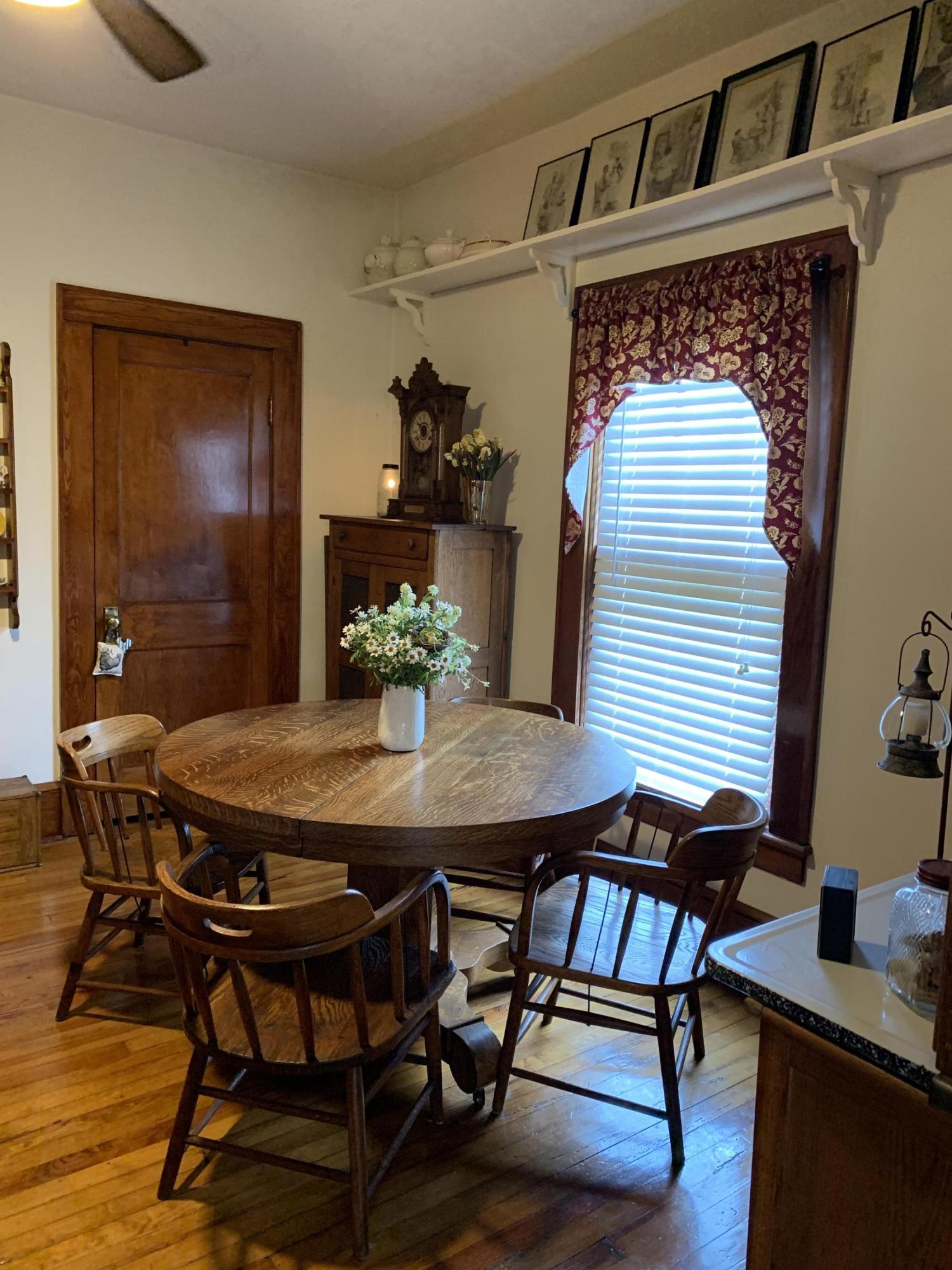 1763 Morgans Mill Road Goodview, VA 24095 - Photo 13 of 46 a dining room with furniture and wooden floor
