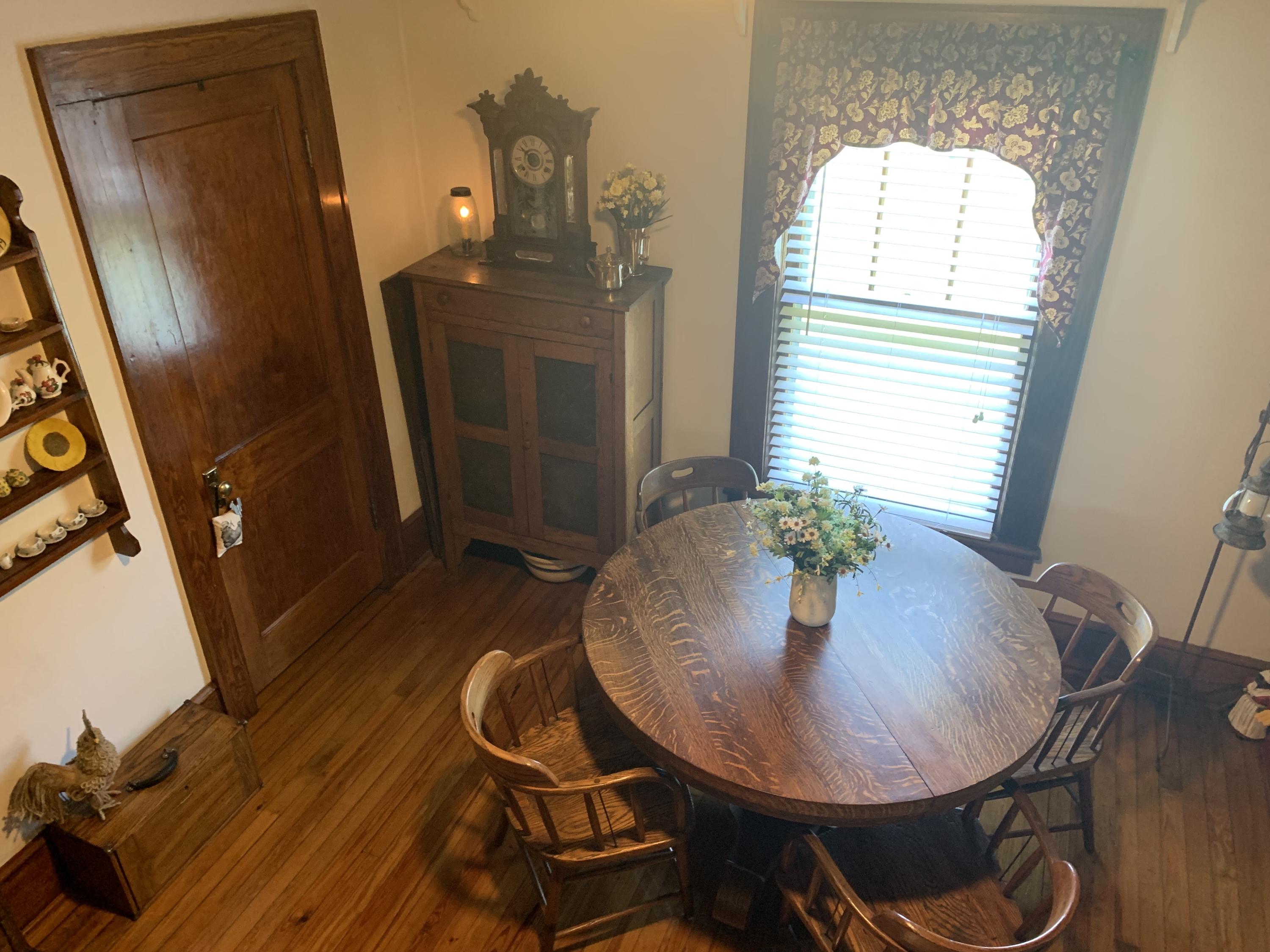 1763 Morgans Mill Road Goodview, VA 24095 - Photo 14 of 46 a workspace with furniture and wooden floor