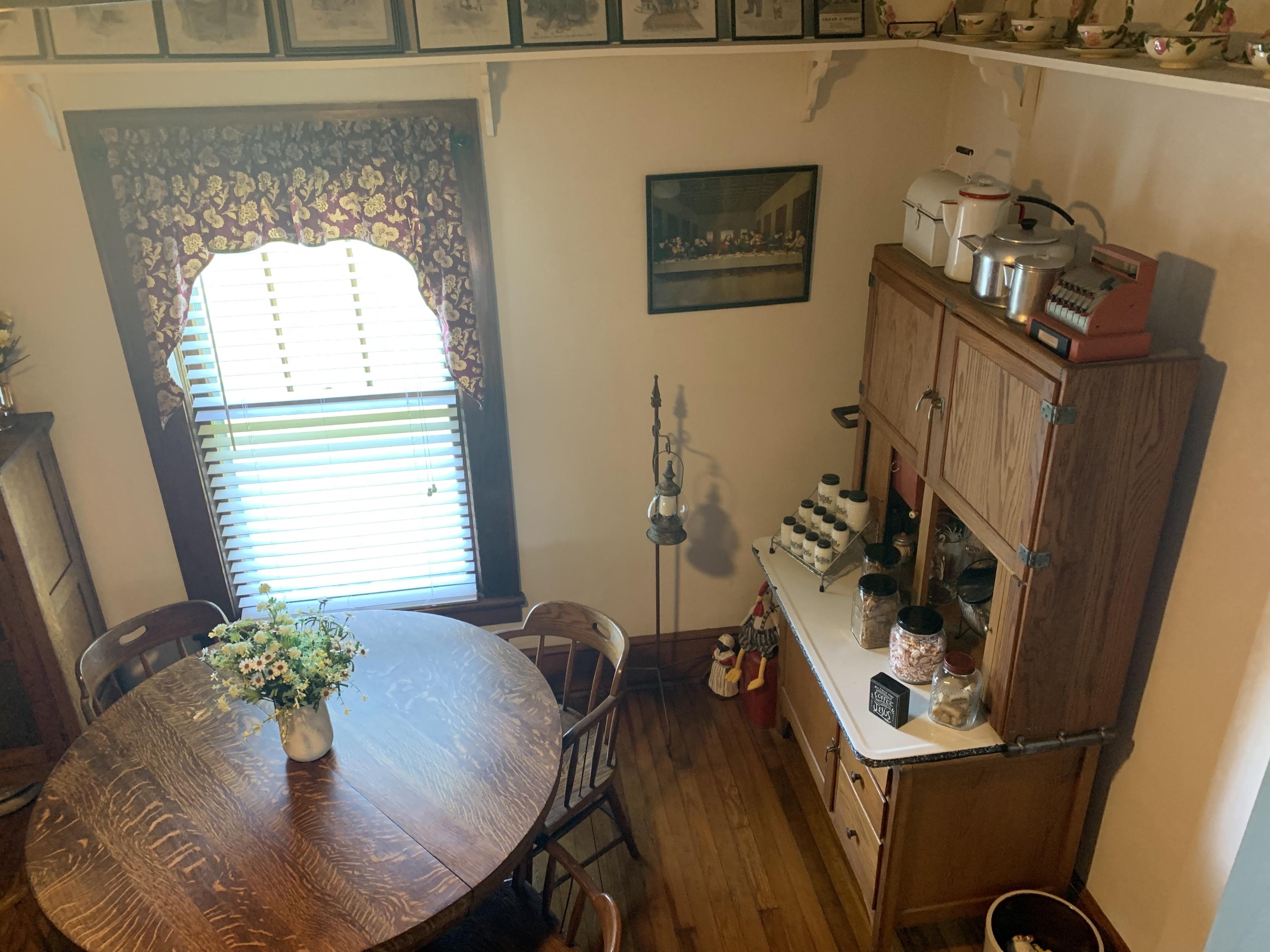 1763 Morgans Mill Road Goodview, VA 24095 - Photo 15 of 46 a view of a workspace with furniture and a potted plant