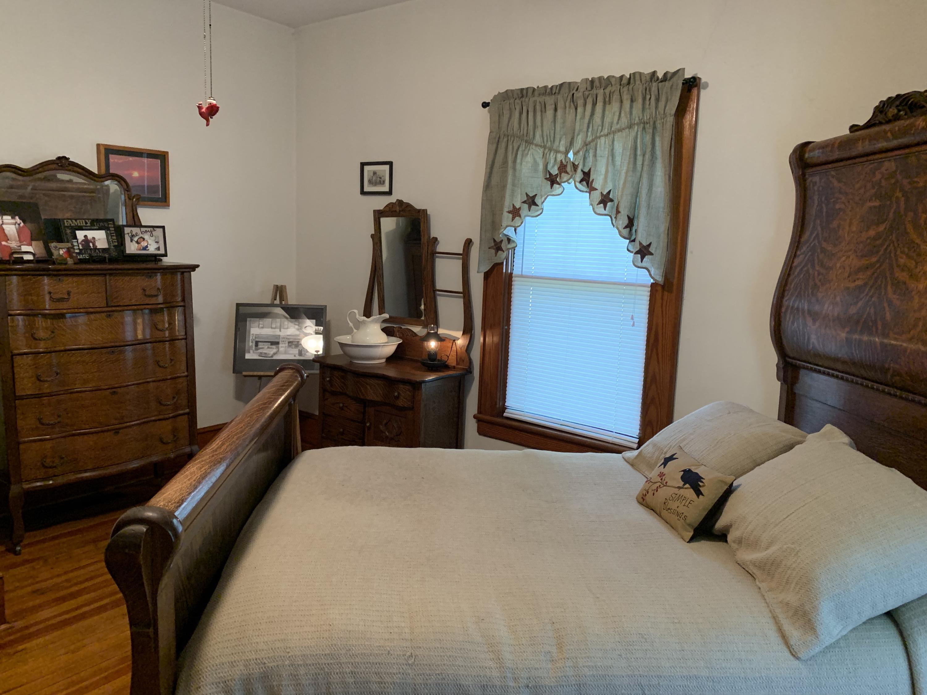 1763 Morgans Mill Road Goodview, VA 24095 - Photo 3 of 46 a bedroom with a bed and dresser