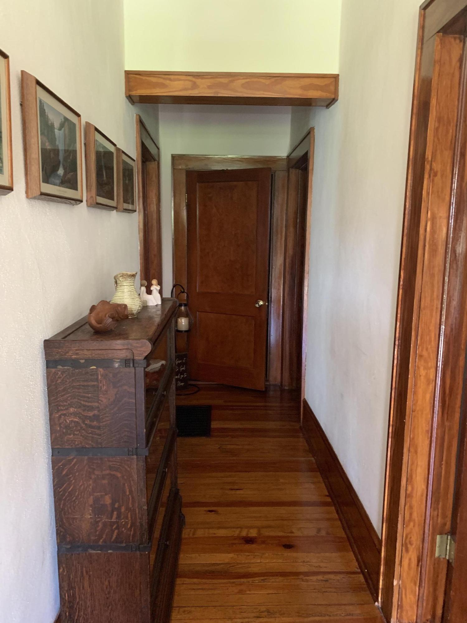 1763 Morgans Mill Road Goodview, VA 24095 - Photo 22 of 46 a room with wooden floor and furniture