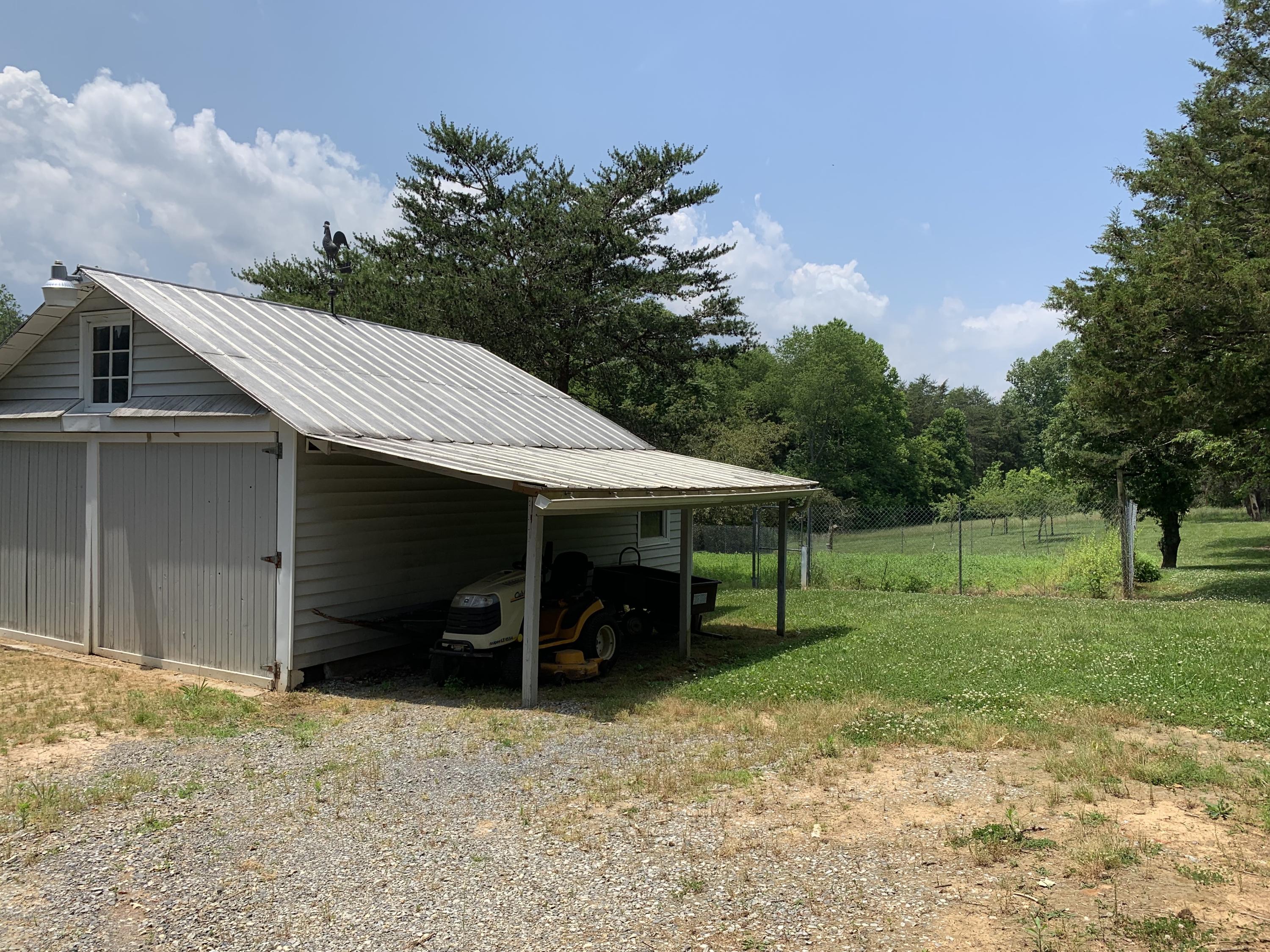 1763 Morgans Mill Road Goodview, VA 24095 - Photo 28 of 46 a view of a barn in the middle of a yard