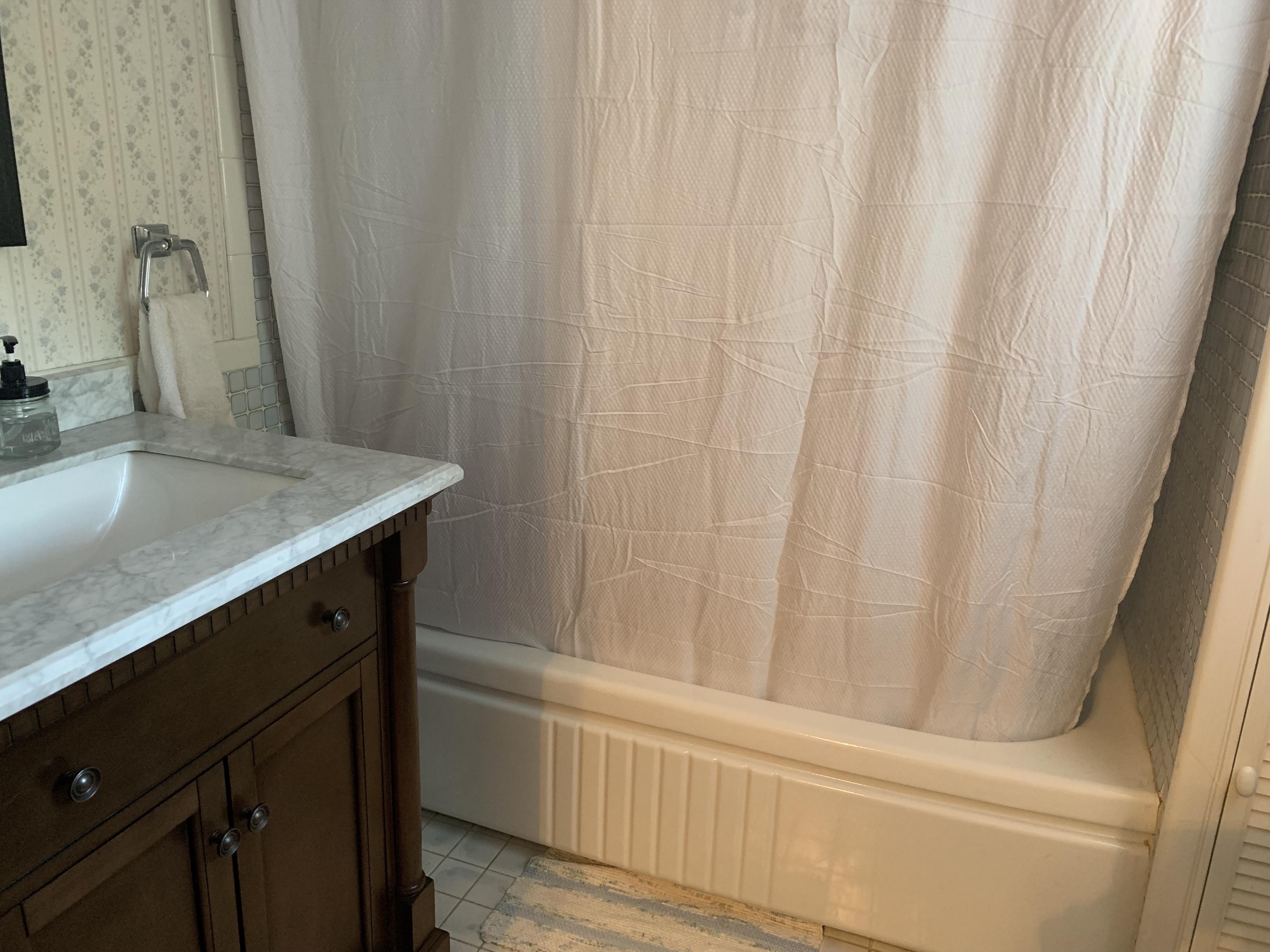 1763 Morgans Mill Road Goodview, VA 24095 - Photo 31 of 46 a bathroom with a sink and a mirror