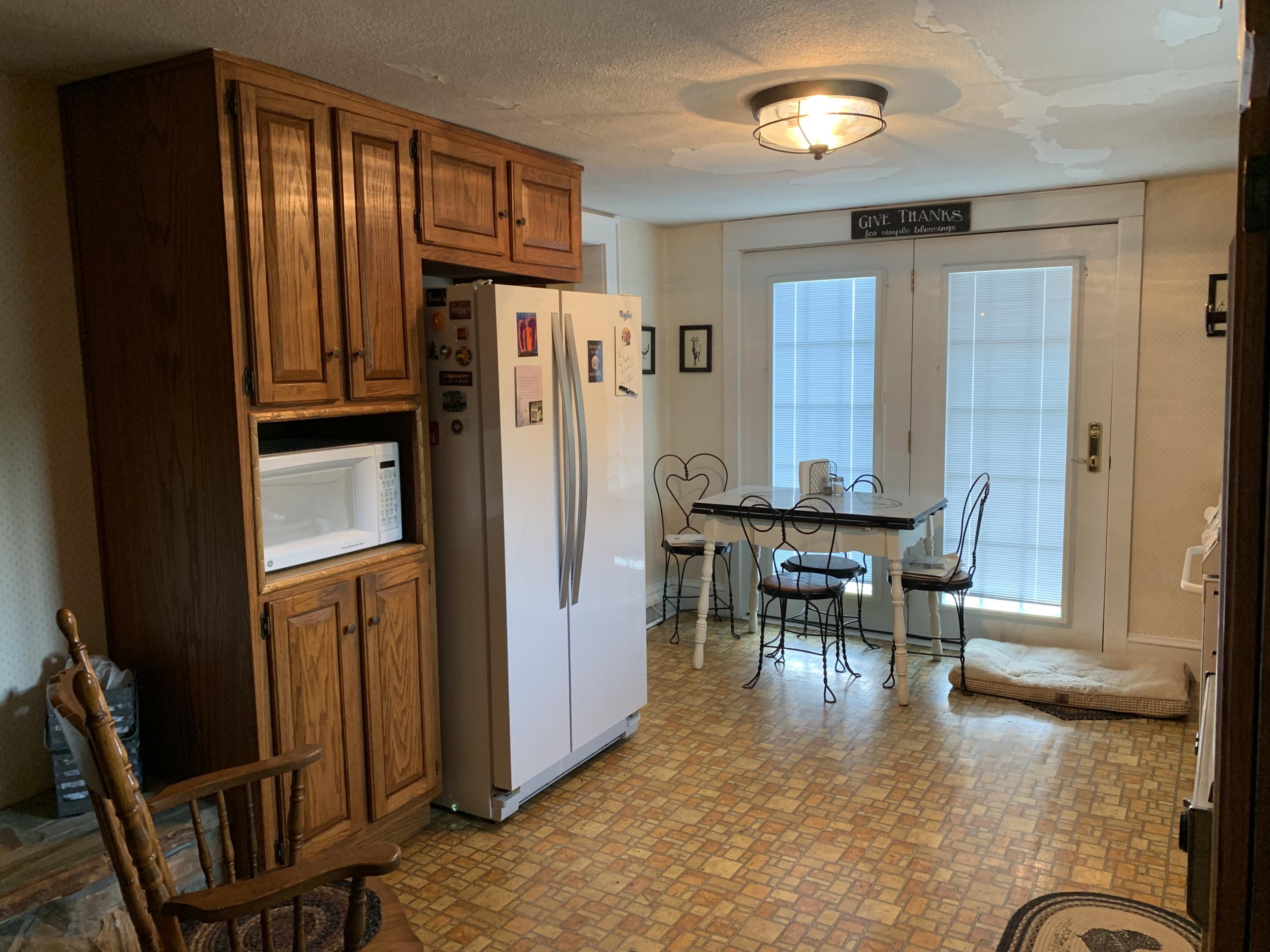 1763 Morgans Mill Road Goodview, VA 24095 - Photo 36 of 46 a dining room with furniture window and wooden floor