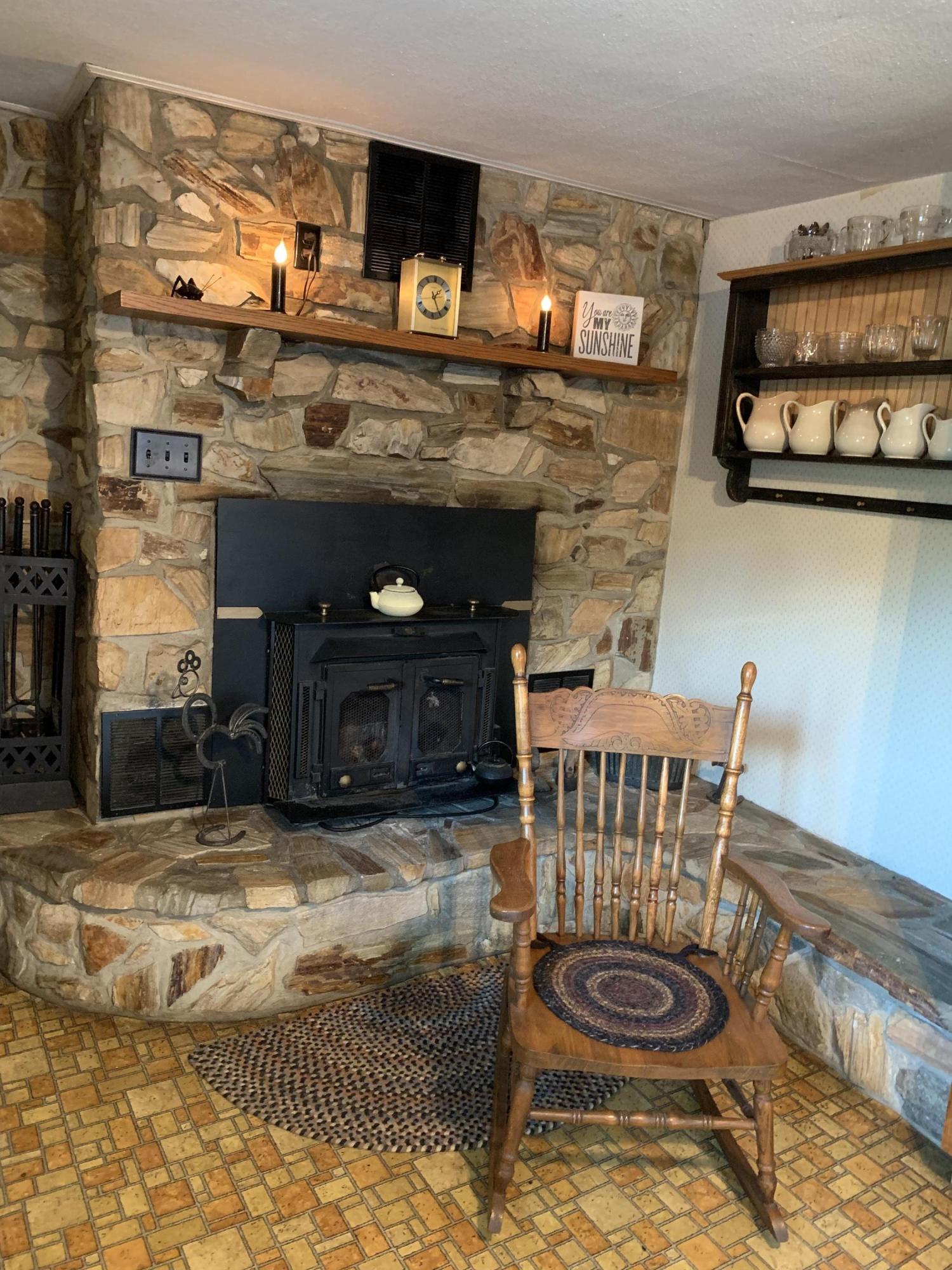1763 Morgans Mill Road Goodview, VA 24095 - Photo 37 of 46 a living room with furniture and a fireplace