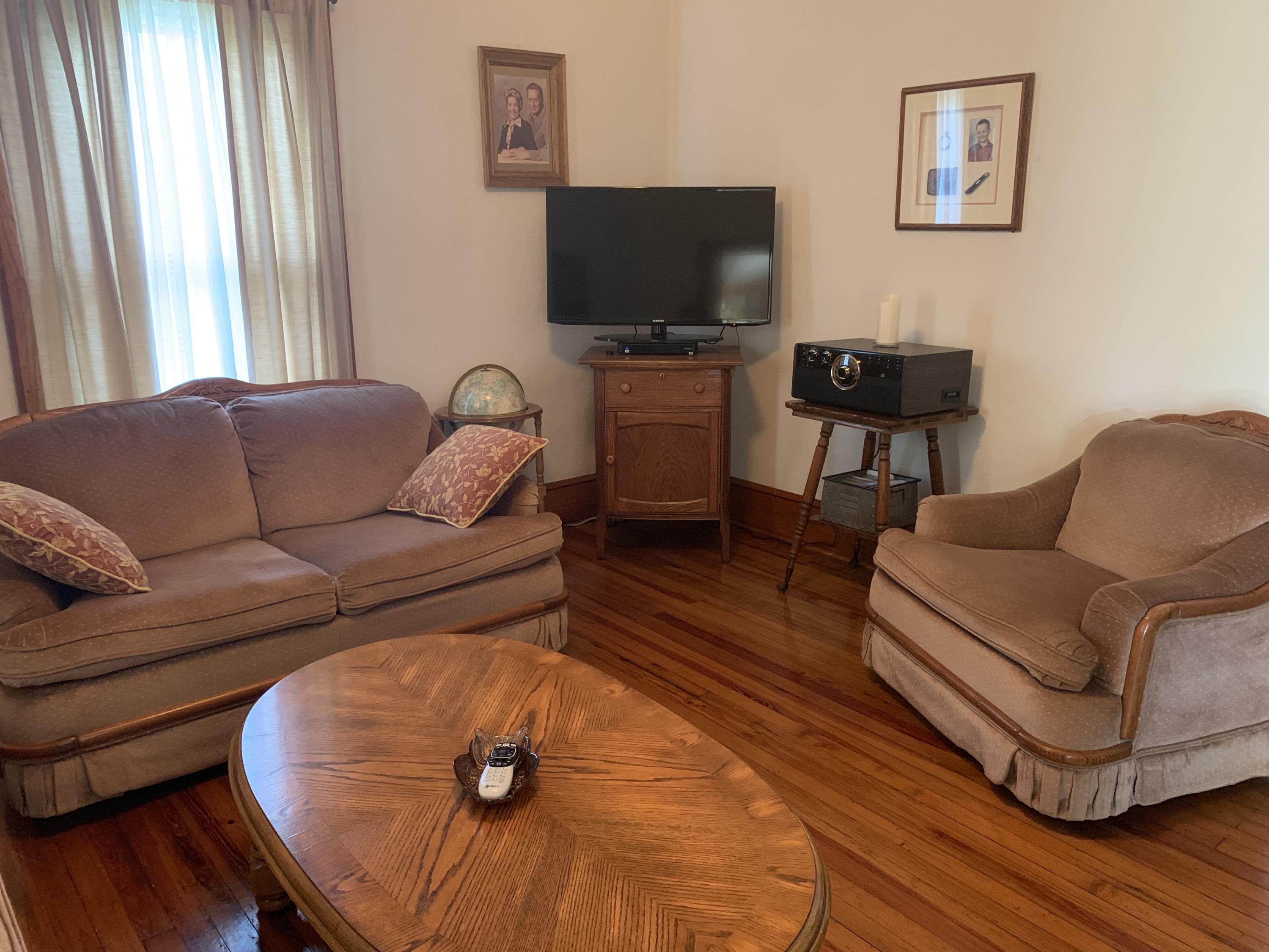 1763 Morgans Mill Road Goodview, VA 24095 - Photo 40 of 46 a living room with furniture and a flat screen tv