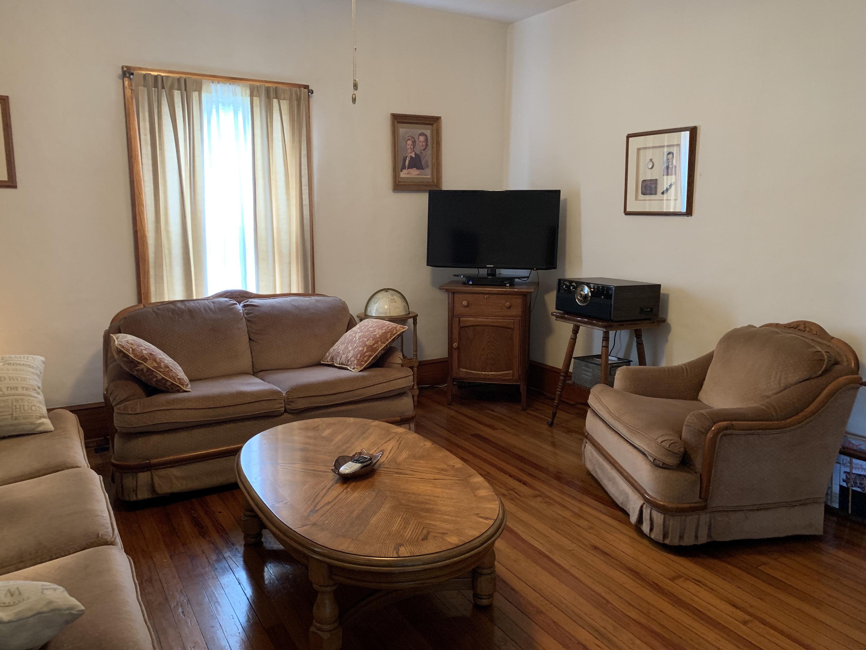 1763 Morgans Mill Road Goodview, VA 24095 - Photo 41 of 46 a living room with furniture and a flat screen tv