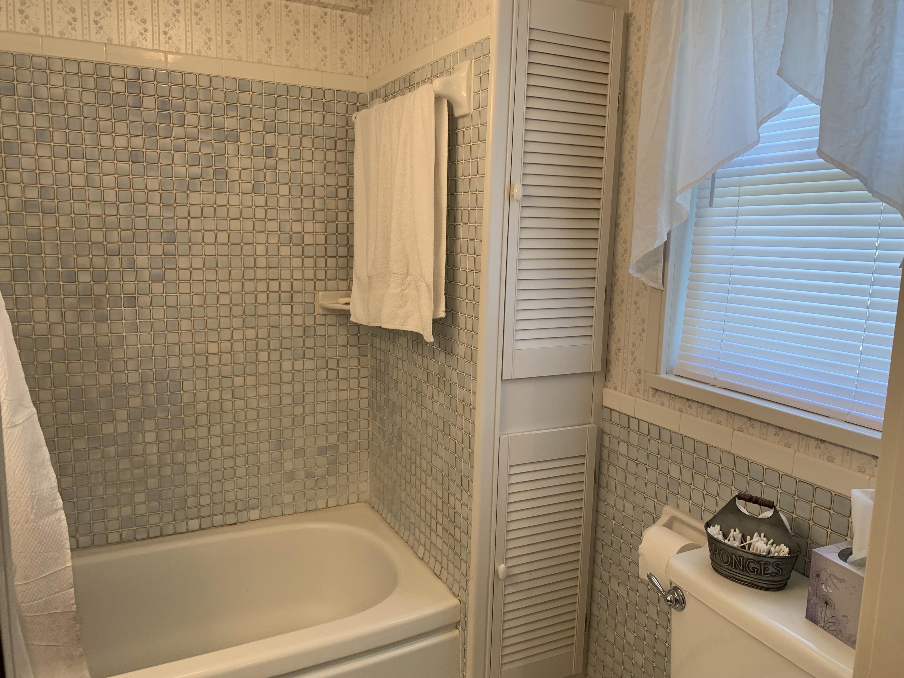 1763 Morgans Mill Road Goodview, VA 24095 - Photo 44 of 46 a bathroom with a bathtub and shower