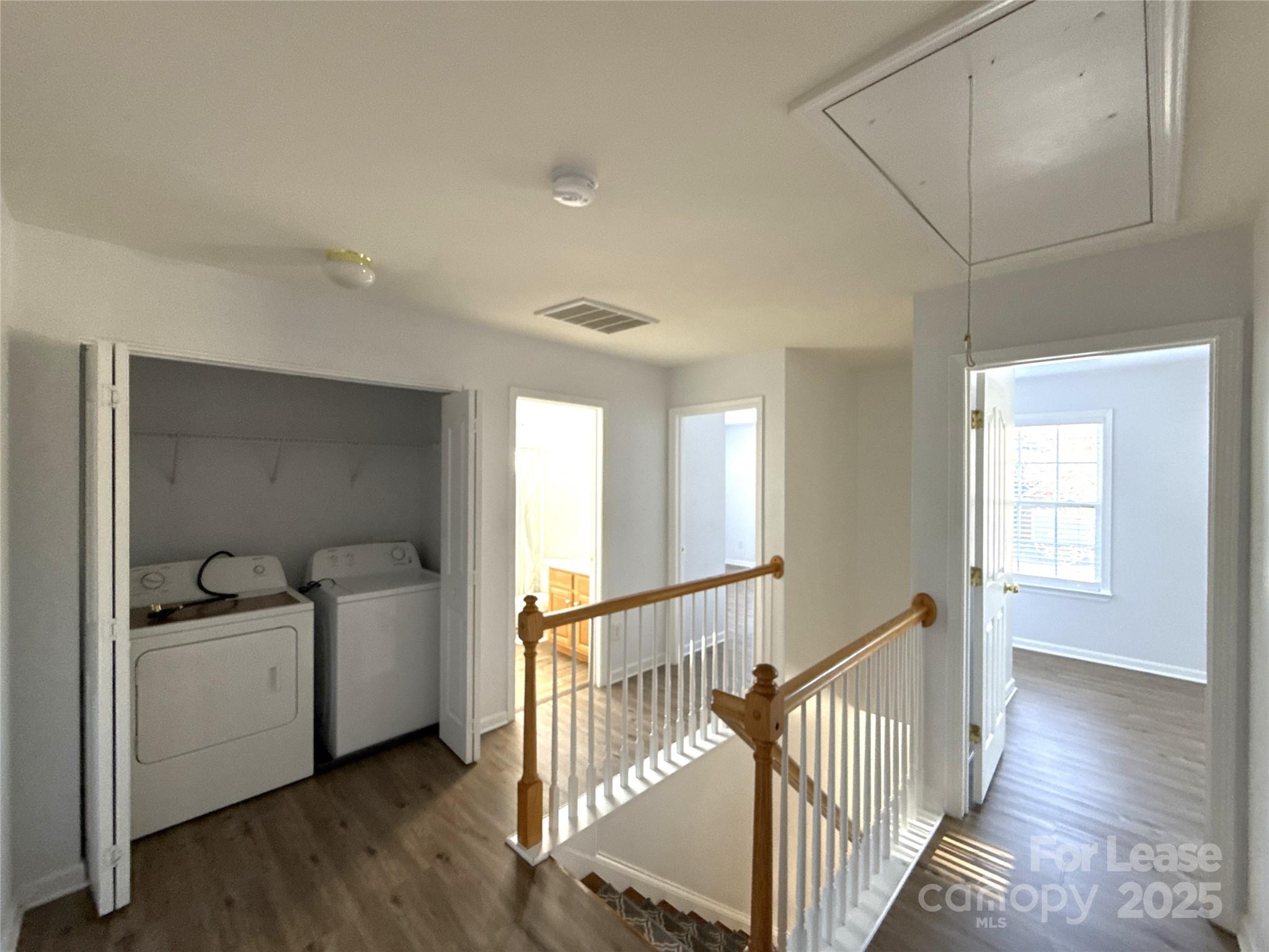 3415 Cole Mill Road Charlotte, NC 28270 - Photo 16 of 18 a view of a hallway with bathroom and wooden floor