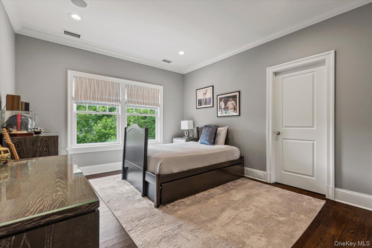 81 Wappanocca Avenue Rye, NY 10580 - Photo 14 of 27 Bedroom featuring ornamental molding, wood finished floors, and recessed lighting