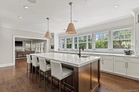 a dining table with chairs and wooden floor