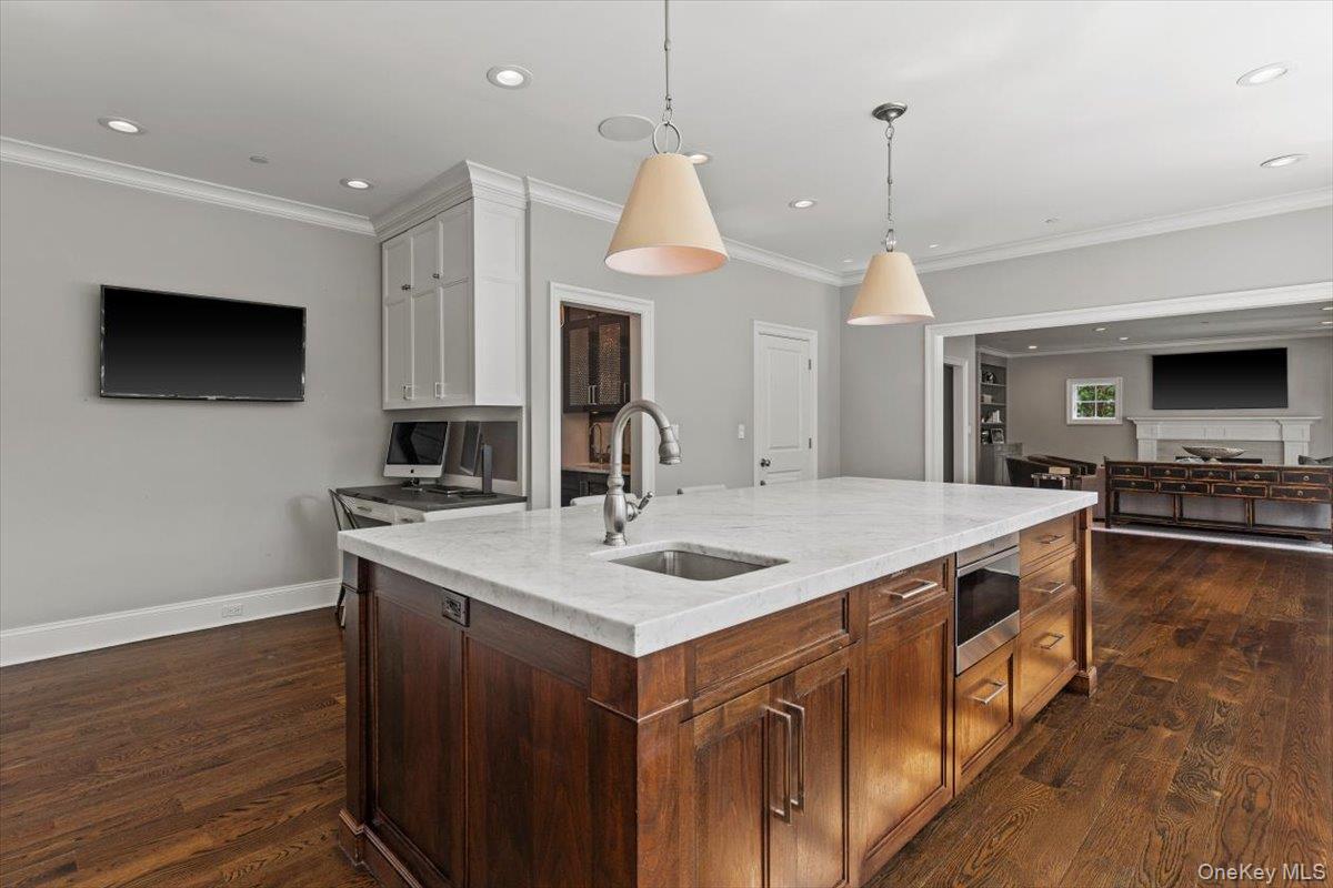 81 Wappanocca Avenue Rye, NY 10580 - Photo 27 of 27 Kitchen with stainless steel microwave, dark wood finished floors, open floor plan, ornamental molding, and recessed lighting