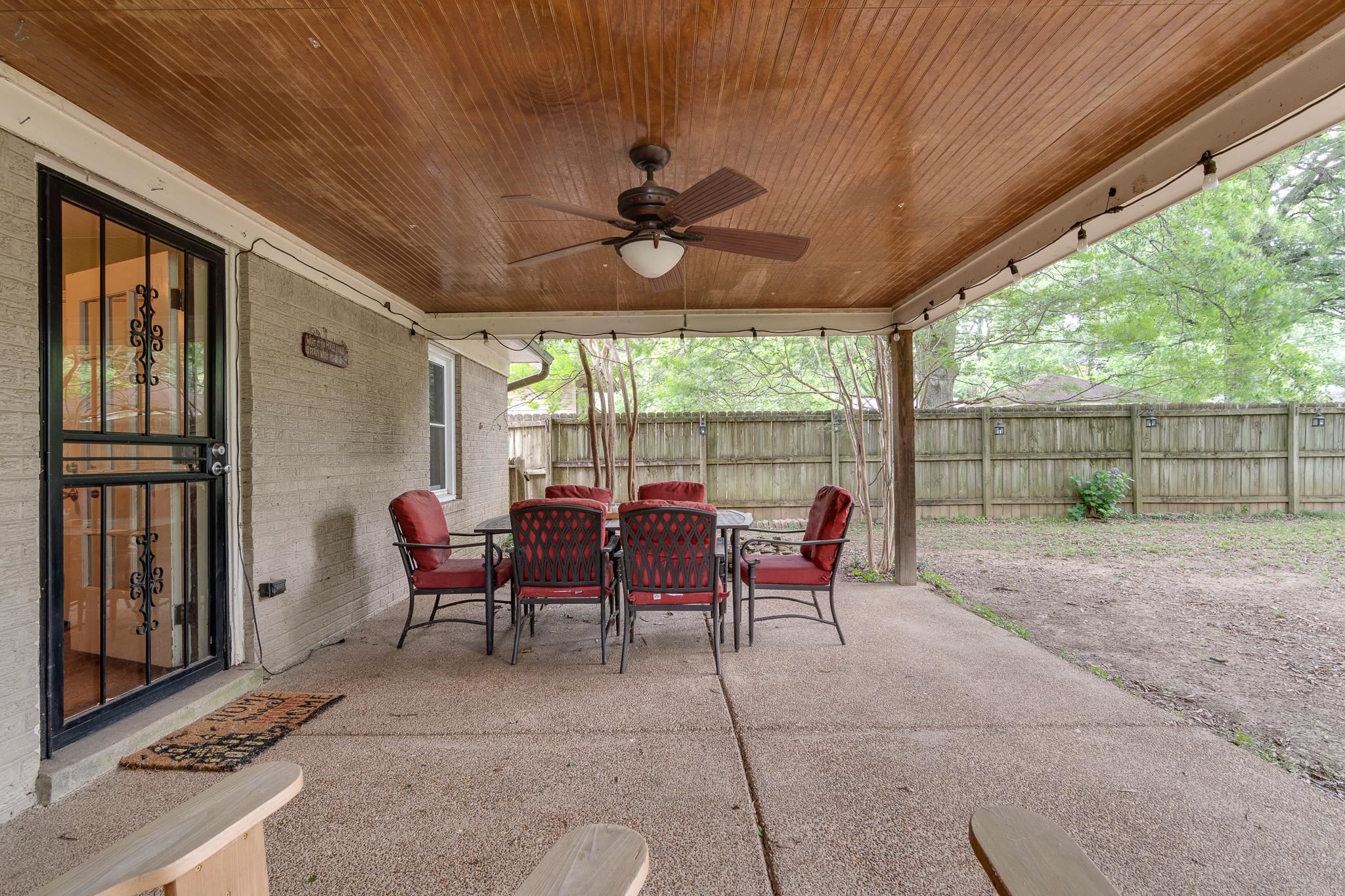 1640 Welsh Road Memphis, TN 38117 - Photo 14 of 15 a view of a patio with table and chairs potted plants with floor to ceiling window