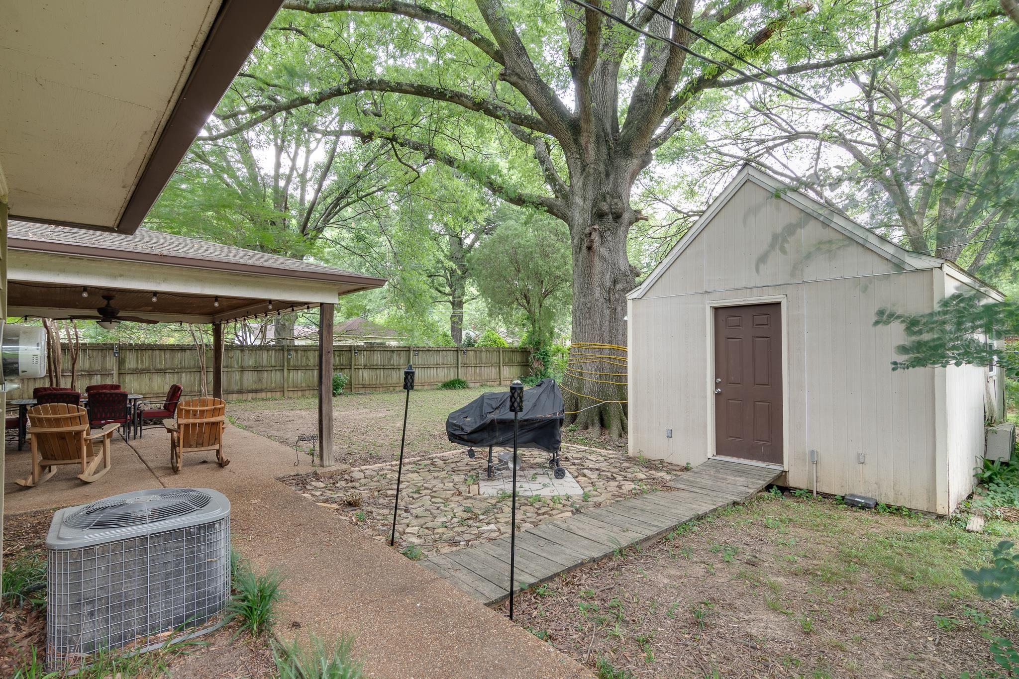 1640 Welsh Road Memphis, TN 38117 - Photo 15 of 15 a backyard of a house with table and chairs