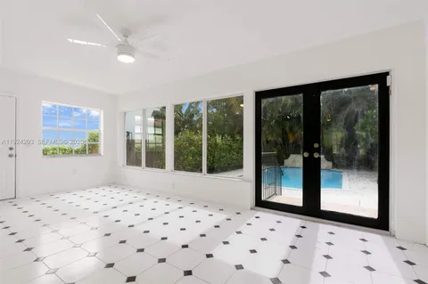 a view of a bedroom with a large window
