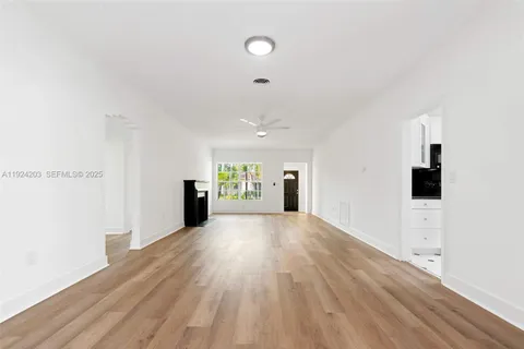 a view of a livingroom with wooden floor