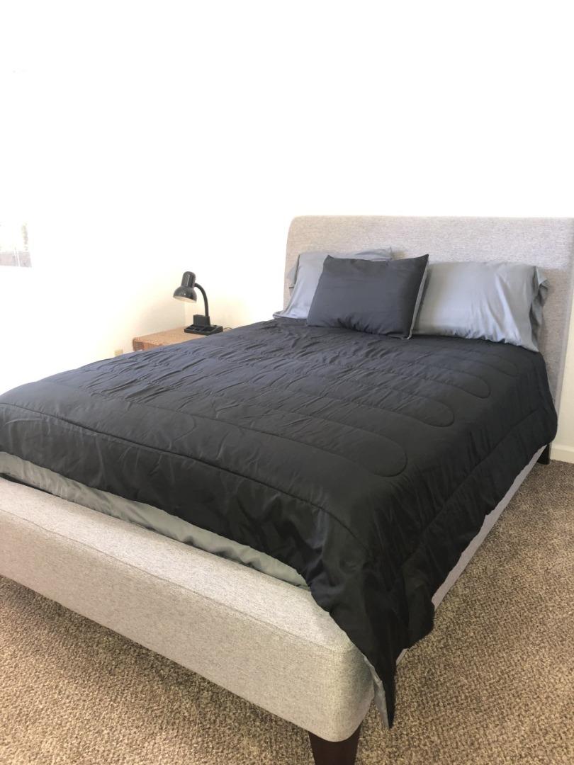4020 Ridge Circle Willits, CA 95490 - Photo 21 of 44 a bedroom with a bed and a night stand