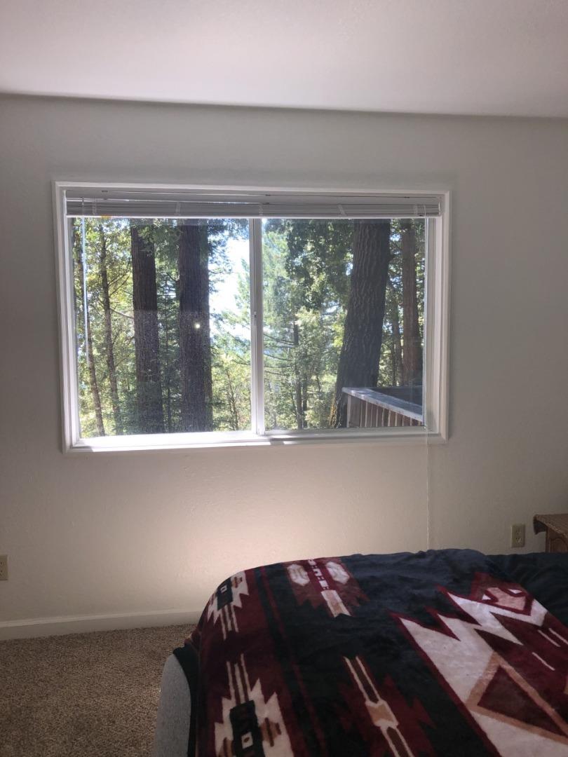 4020 Ridge Circle Willits, CA 95490 - Photo 25 of 44 a bed sitting in a bedroom next to a window