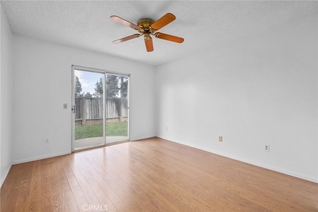 5423 Dunlop Drive Riverside, CA 92505 - Photo 16 of 28 an empty room with fan and windows
