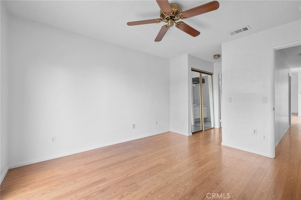 5423 Dunlop Drive Riverside, CA 92505 - Photo 17 of 28 wooden floor in an empty room with a window