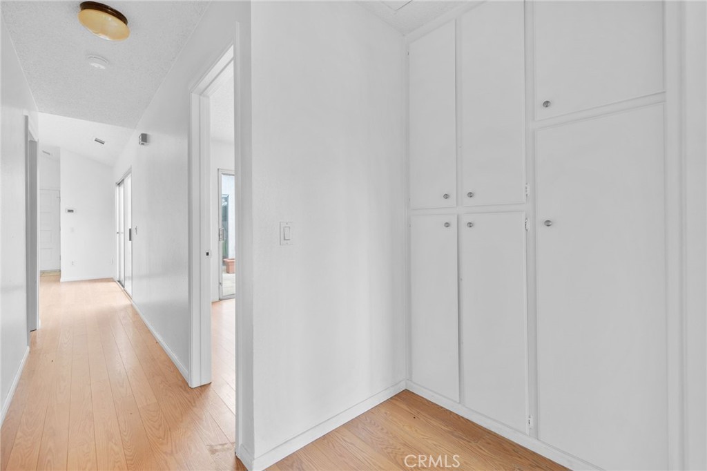 5423 Dunlop Drive Riverside, CA 92505 - Photo 22 of 28 a view of a hallway with wooden floor