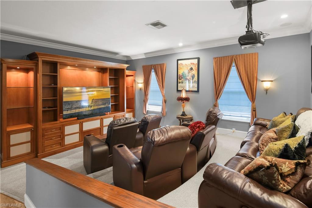 649 Bow Line Drive Naples, FL 34103 - Photo 18 of 31 a living room with furniture and a flat screen tv