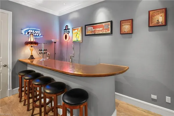 a dining room with furniture and a chandelier