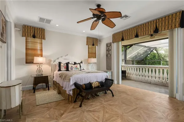 a bed room with a bed and a chandelier