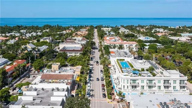 an aerial view of residential building and ocean