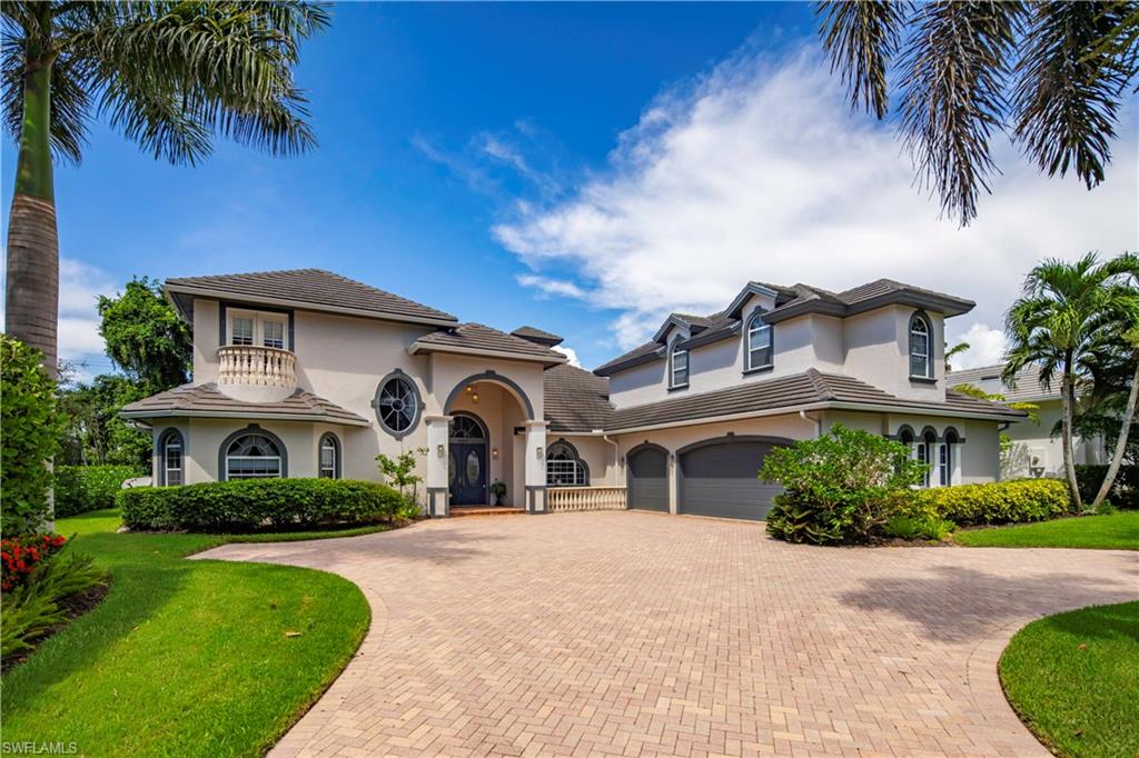 649 Bow Line Drive Naples, FL 34103 - Photo 31 of 31 a front view of a house with a garden