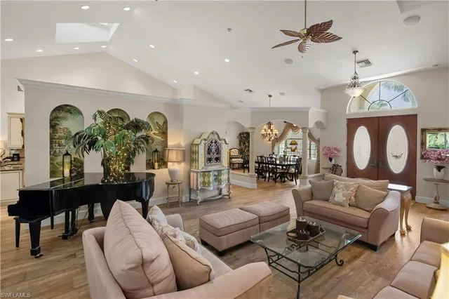 a living room with furniture and wooden floor