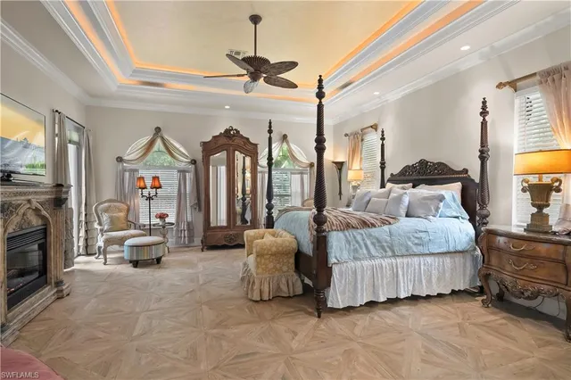 a spacious bedroom with a bed couch and window