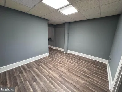 a kitchen with a white stove top oven and refrigerator