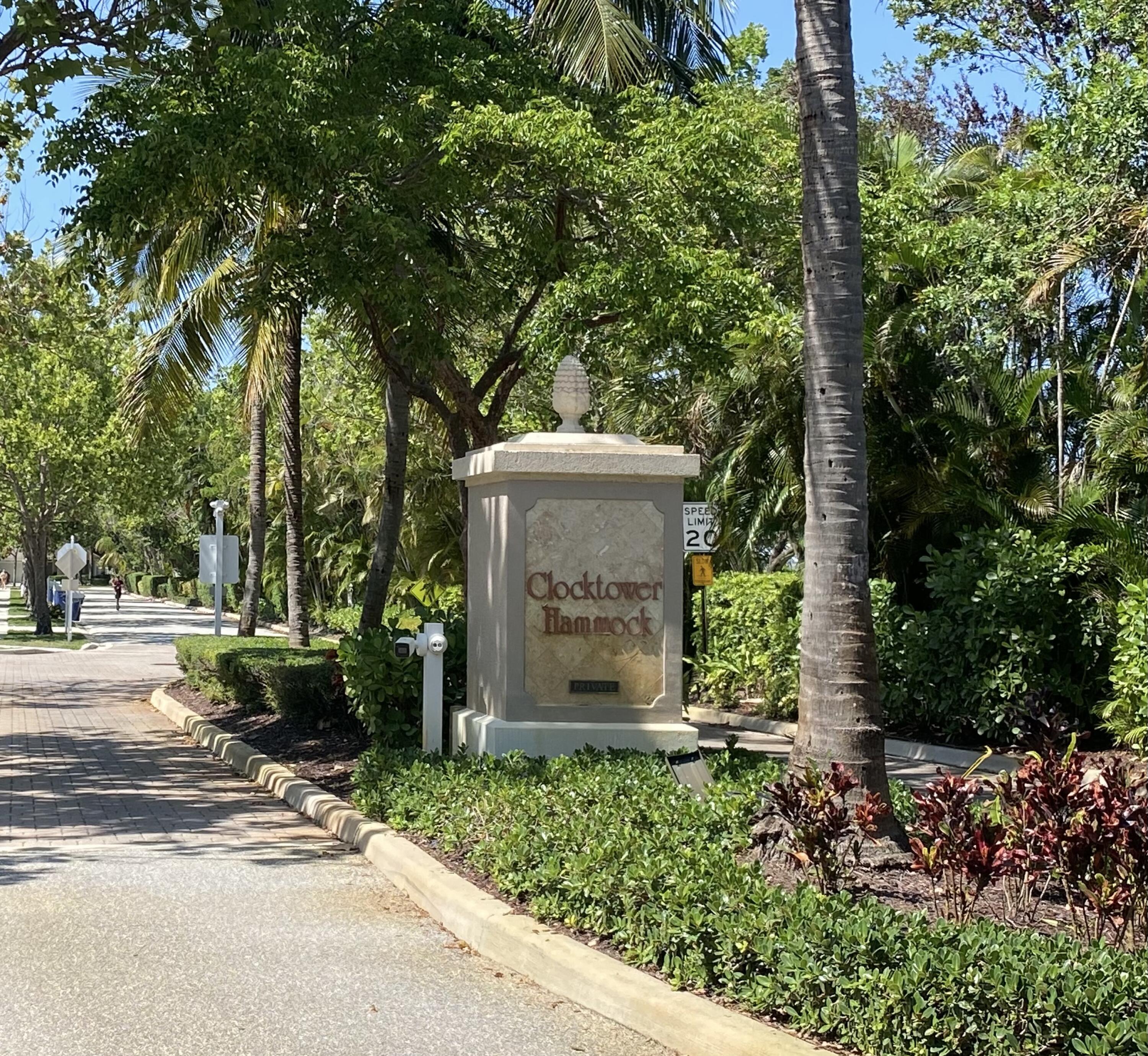 225 Clocktower Drive Jupiter, FL 33458 - Photo 2 of 40 a front view of a house with a garden