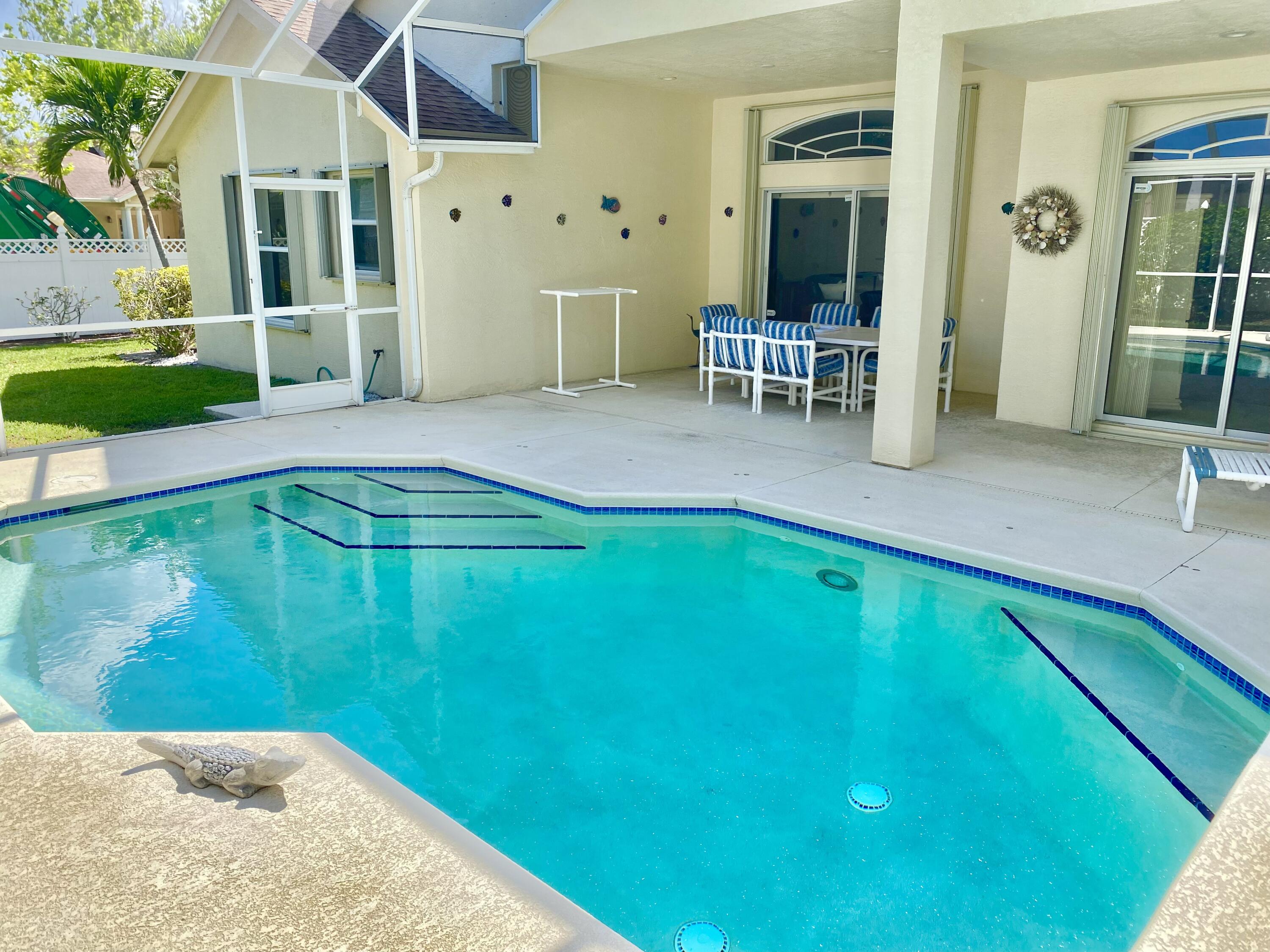 225 Clocktower Drive Jupiter, FL 33458 - Photo 24 of 40 swimming pool view with a outdoor seating