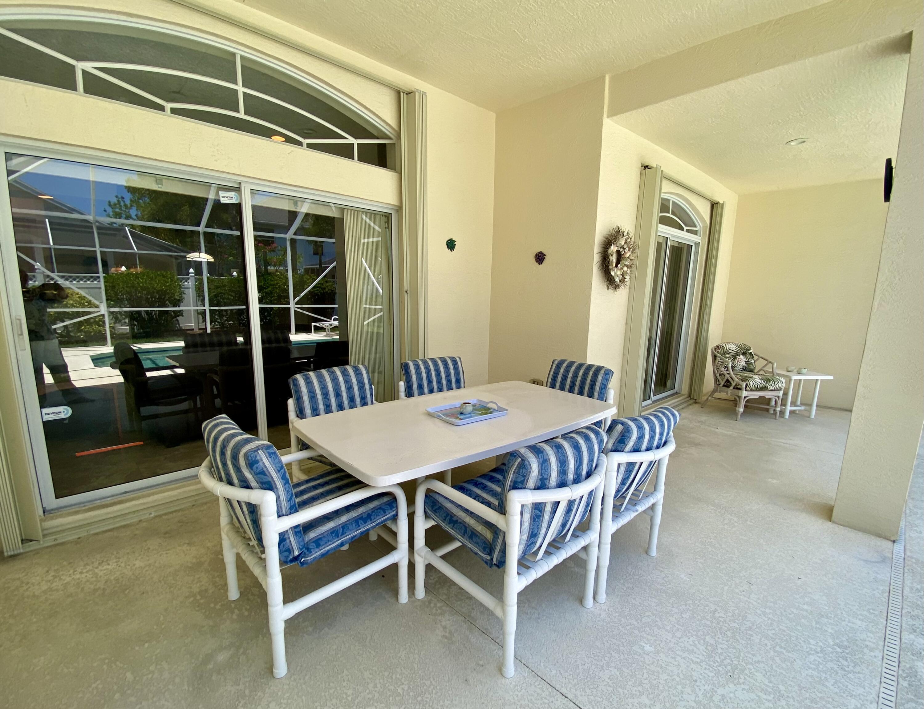 225 Clocktower Drive Jupiter, FL 33458 - Photo 25 of 40 a dining room with furniture and window