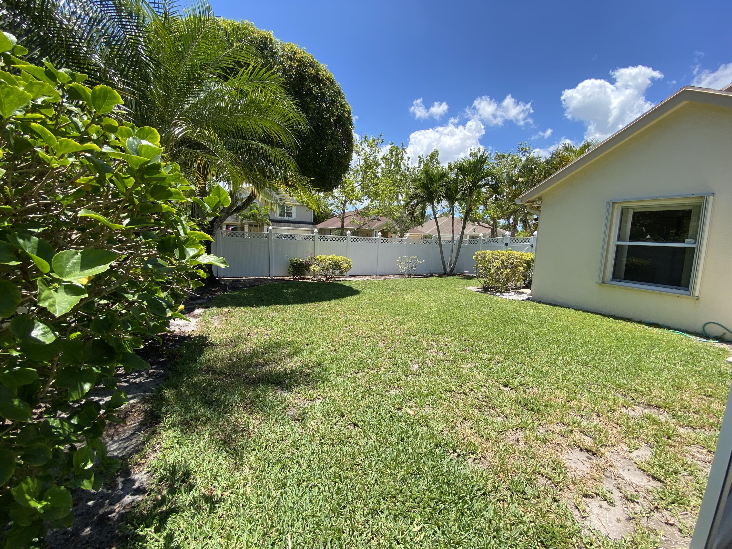 225 Clocktower Drive Jupiter, FL 33458 - Photo 29 of 40 a view of a backyard of the house