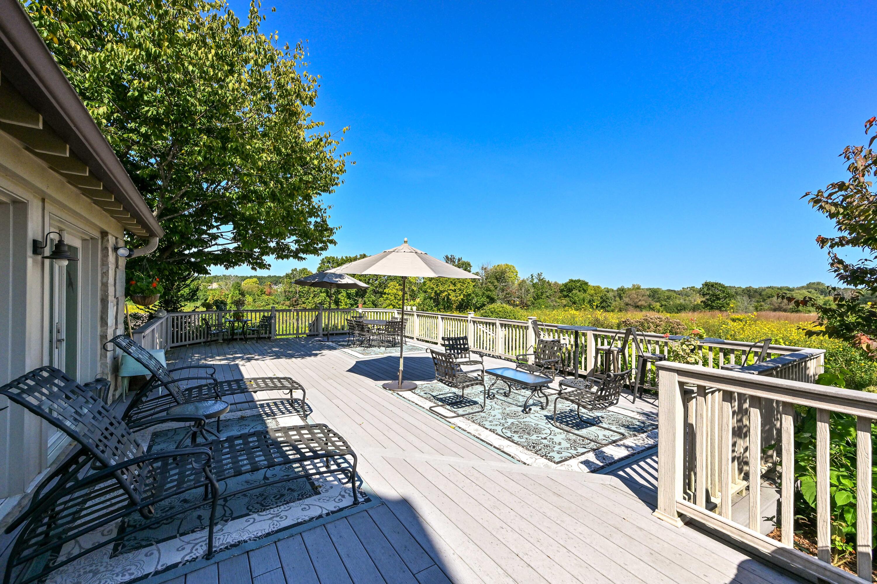 3200 West Bonniwell Road Mequon, WI 53097 - Photo 32 of 77 Absolutely massive composite deck, for entertaining, or quiet nights.